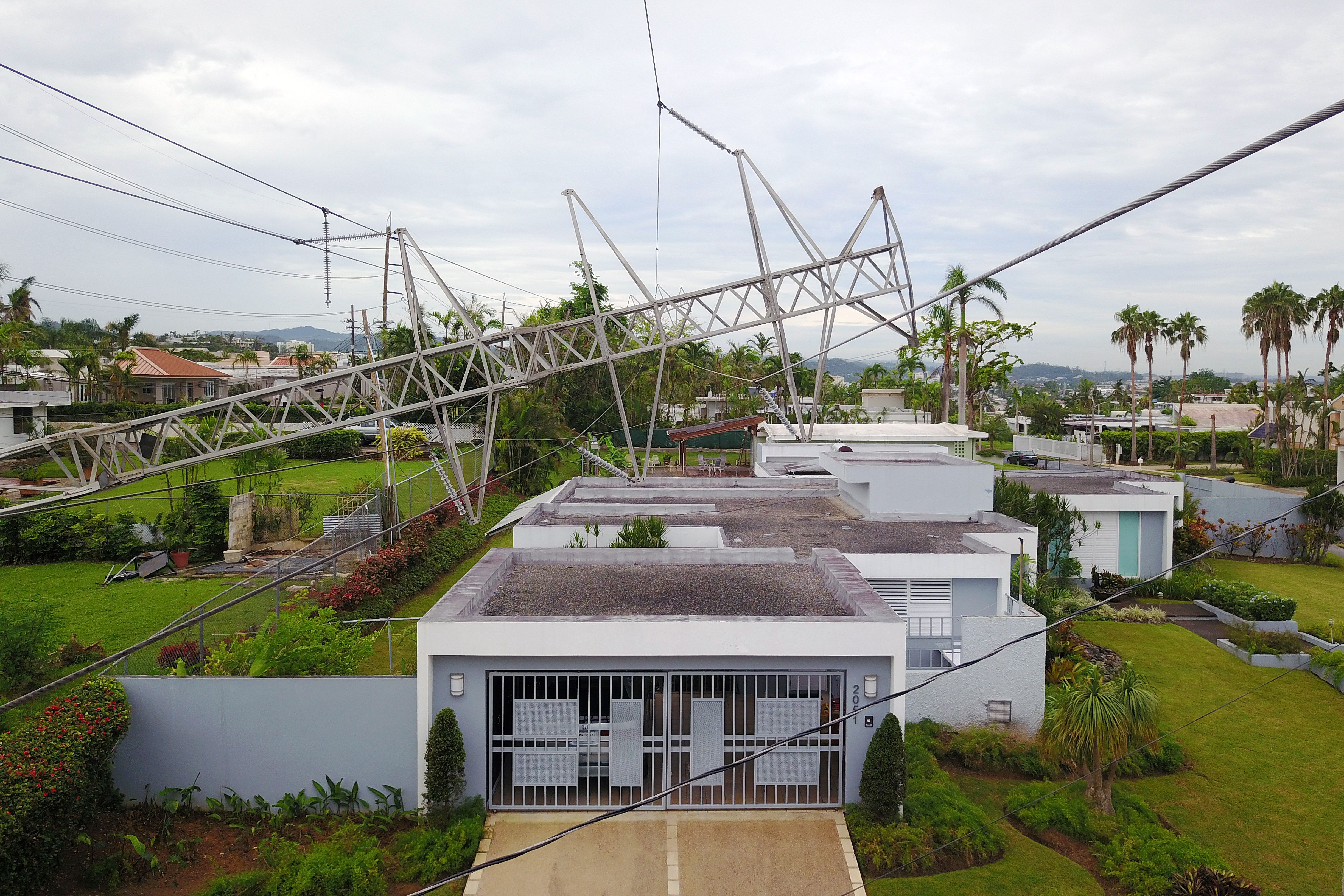 Workers have been struggling to restore power to Puerto Rico since Hurricane Maria hit the island in September 2017. CREDIT: RICARDO ARDUENGO/AFP/Getty Images