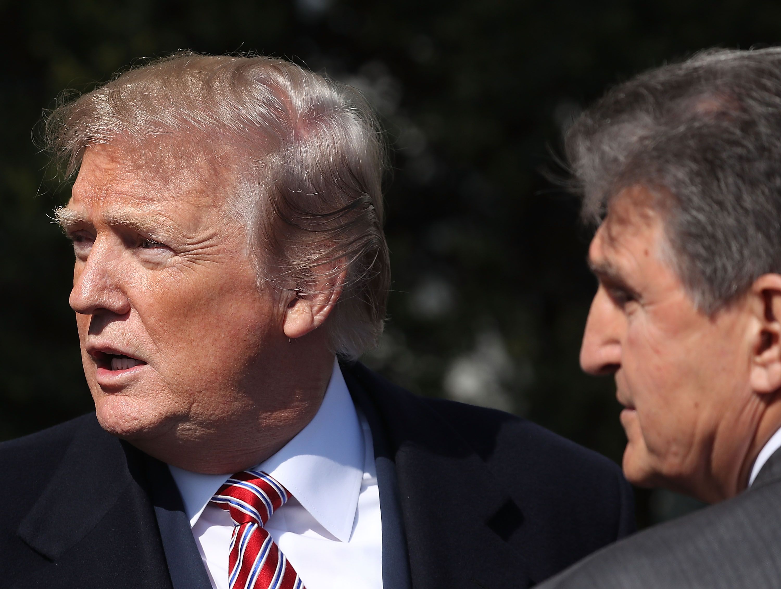 President Trump and Sen. Joe Manchin (D-WV) are considering ways for taxpayers to subsidize the coal and nuclear power industries. CREDIT: Mark Wilson/Getty Images