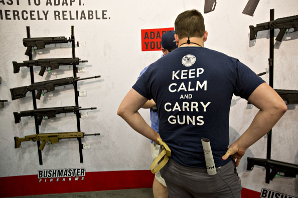Attendees browse Bushmaster Firearms at the National Rifle Association (NRA) annual meeting in Dallas, Texas
CREDIT: Daniel Acker/Getty Images