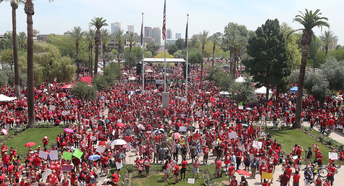 Thousands of Arizona teachers descend on the State Capitol during a rally for the #REDforED movement on April 26, 2018 in Phoenix, Arizona. (CREDIT: Ralph Freso/Getty Images)