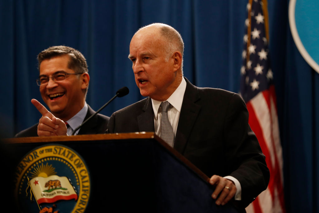 AT A PRESS BRIEFING AT THE STATE CAPITOL ON MAY 1, 2018 IN SACRAMENTO, CALIFORNIA, Gov. Jerry Brown and state Attorney General Xavier Becerra announced that California has joined 16 other states and the District of Columbia in suing the EPA over vehicle emissions standards. CREDIT: Stephen Lam/Getty Images