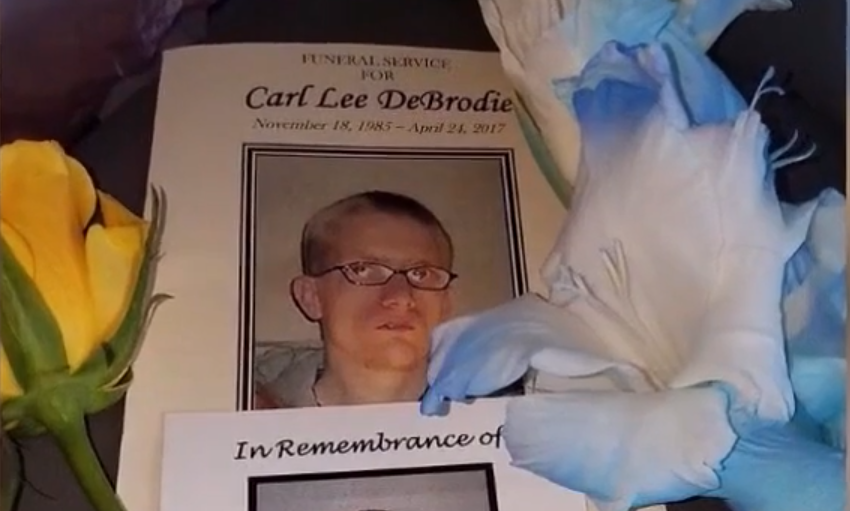 An image of Carl DeBrodie's funeral pamphlet. (Credit: ABC 17 News, Screenshot)
