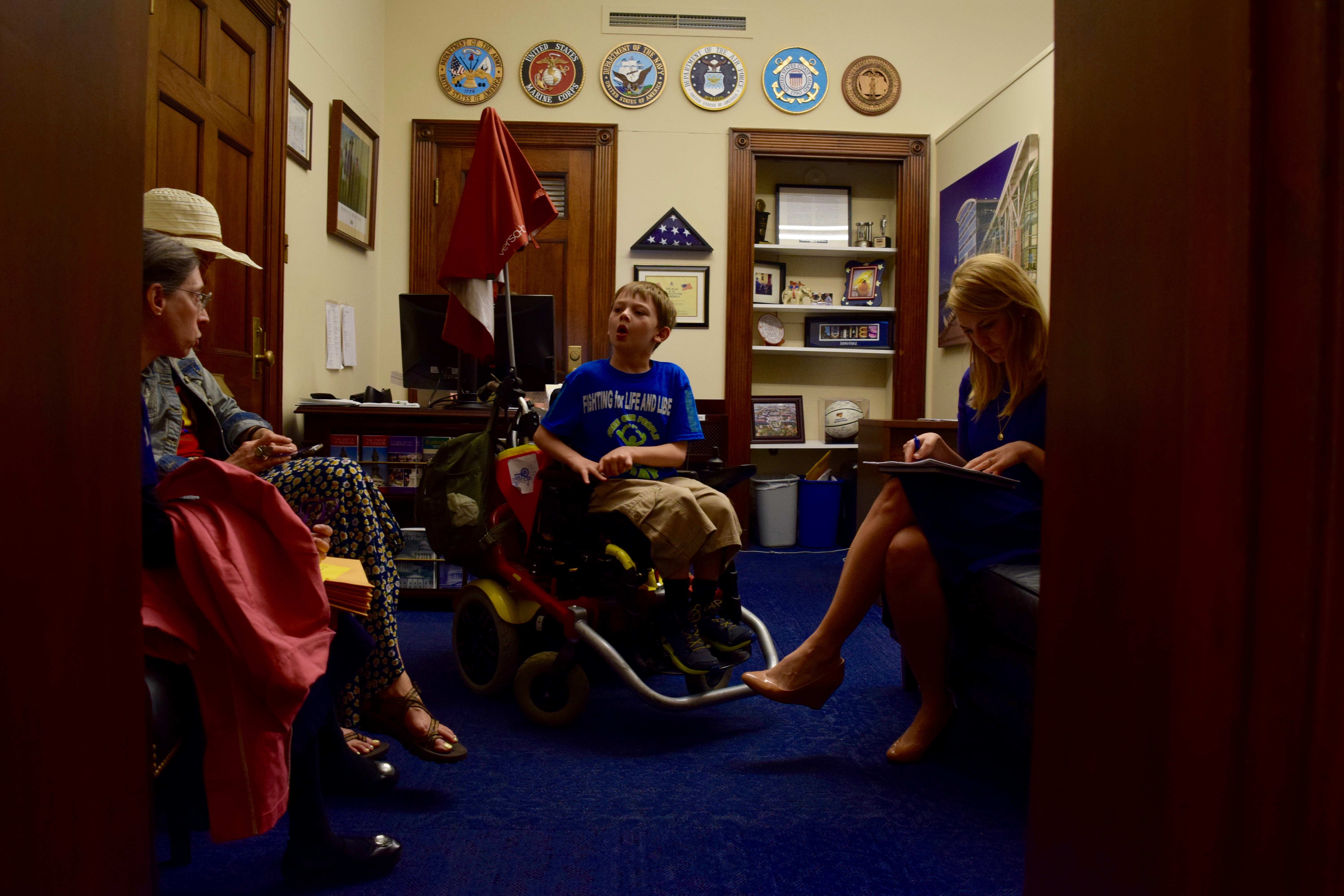 Heath, his mom Jenny Montgomery, and Sheryl Grossman speak with Rep. Rod Blum's (R-IA) staff in Washington, D.C. about DIA, May 16, 2018.
(CREDIT: Amanda Michelle Gomez)