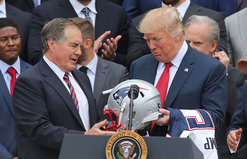 WASHINGTON D.C. - APRIL 19: New England Patriots head coach Bill Belichick presents President Donald Trump with a New England Patriots helmet while team owner Robert Kraft looks on at right during a ceremony at the White House in Washington D.C. on Apr. 19, 2017. (Photo by John Tlumacki/The Boston Globe via Getty Images)