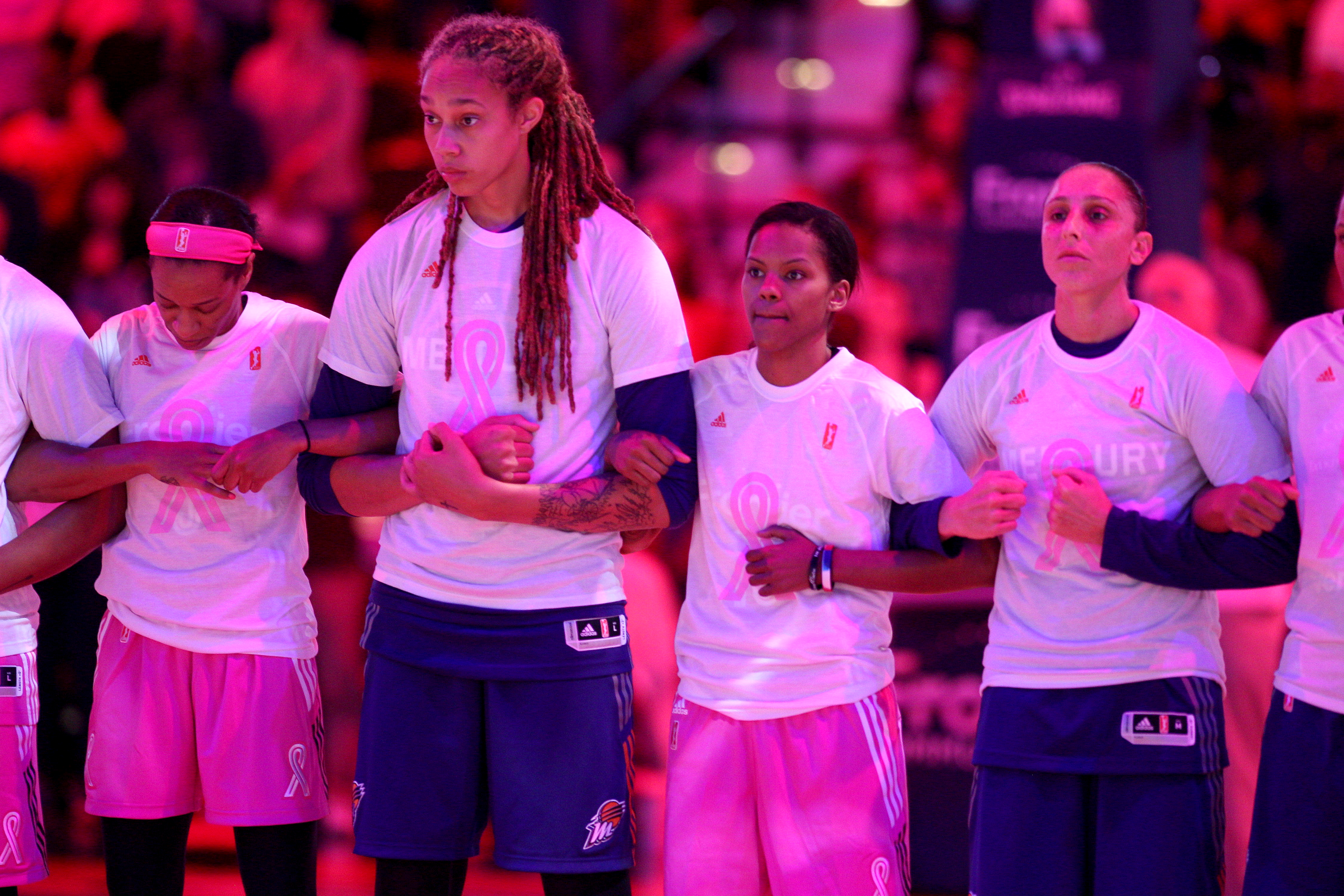 UNCASVILLE, CONNECTICUT- AUGUST 20: Jasmine Thomas #5 of the Connecticut Sun, Brittney Griner #42 of the Phoenix Mercury, Courtney Williams #10 of the Connecticut Sun and Diana Taurasi #3 of the Phoenix Mercury stand united in solidarity for Charlottesville before the Connecticut Sun Vs Phoenix Mercury, WNBA regular season game at Mohegan Sun Arena on August 20th, 2017 in Uncasville, Connecticut. (Photo by Tim Clayton/Corbis via Getty Images)