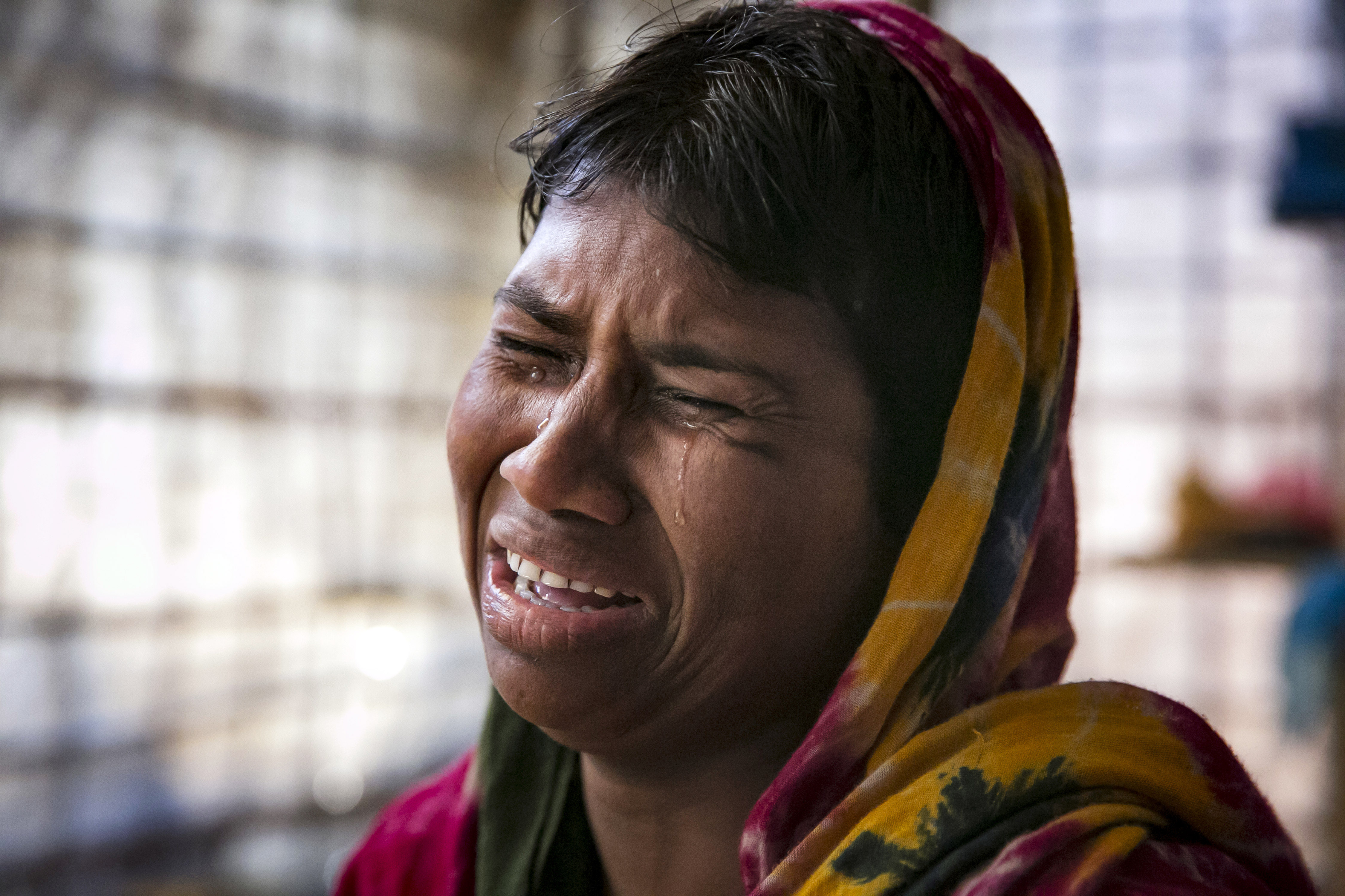 Dildar Begum, 30, said she fled to Bangladesh shortly after the August 25th attack from Tula Toli village in Myanmar. The military, she said, killed her husband and her three children before holding her down and raping her. (CREDIT: Allison Joyce/Getty Images.)