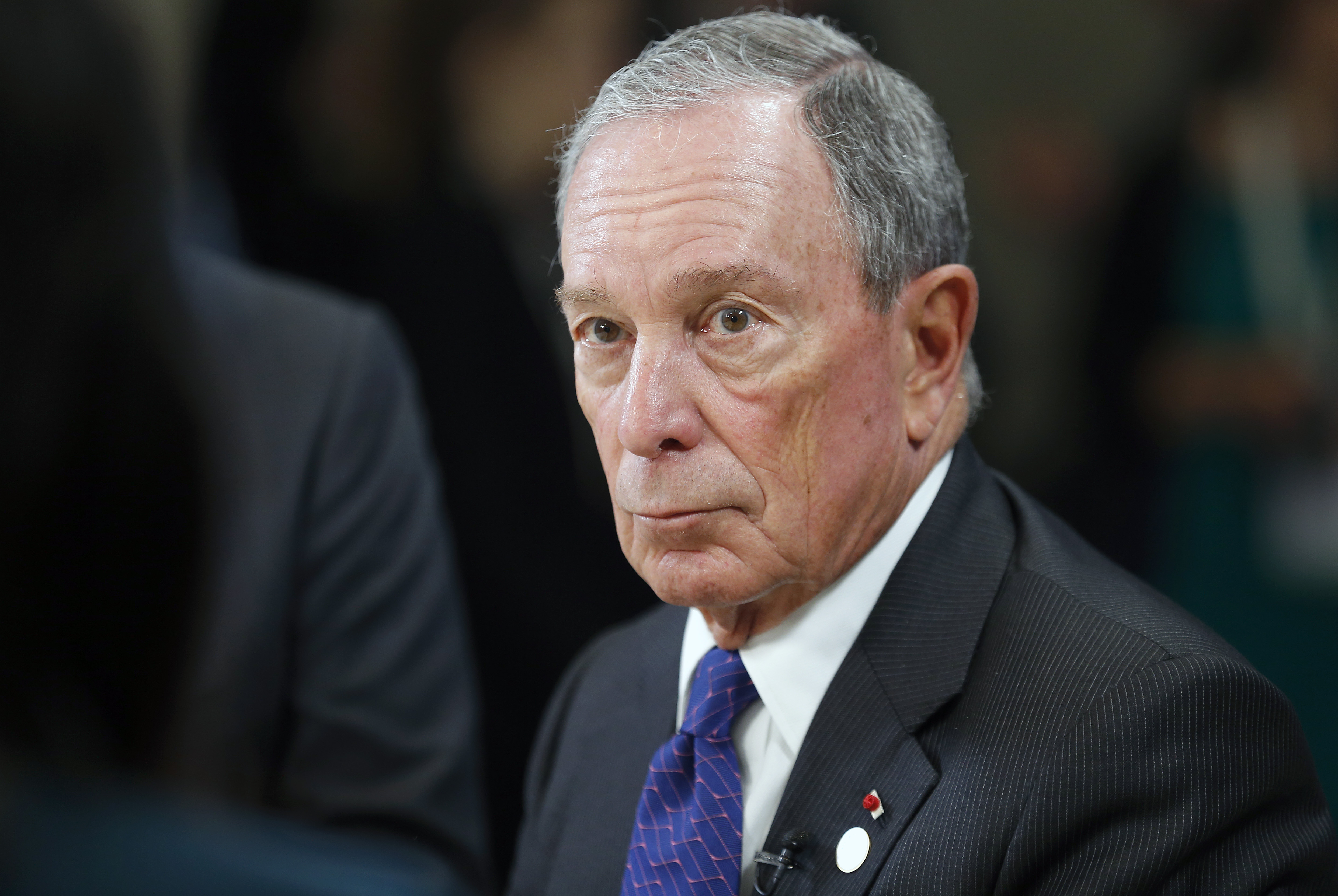 Michael Bloomberg speaks to a journalist during the One Planet Summit at the Seine Musicale on the Ile Sequin on December 12 in Boulogne-Billancourt, France. (Photo by Chesnot/Getty Images)