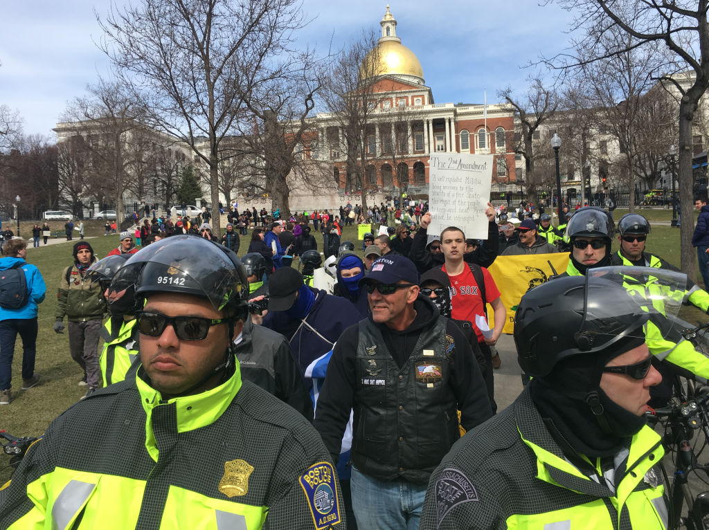 BOSTON, MA - MARCH 24: Pro-gun counter-protesters leave the Massachusetts State House, where they hosted a Resist Marxism Defend the 2nd Amendment rally, and walk towards the March For Our Lives at the Boston Common on March 24, 2018. (Photo by Craig F. Walker/The Boston Globe via Getty Images)