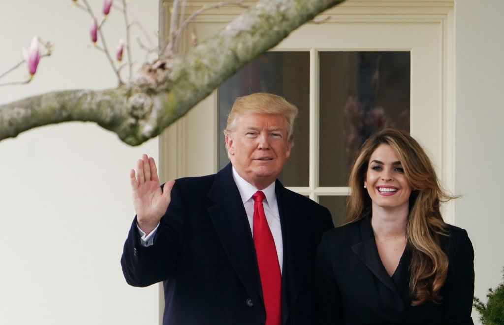 US President Donald Trump poses with former communications director Hope Hicks shortly before making his way to board Marine One on the South Lawn and departing from the White House on March 29, 2018.
(CREDIT: MANDEL NGAN/AFP/Getty Images)