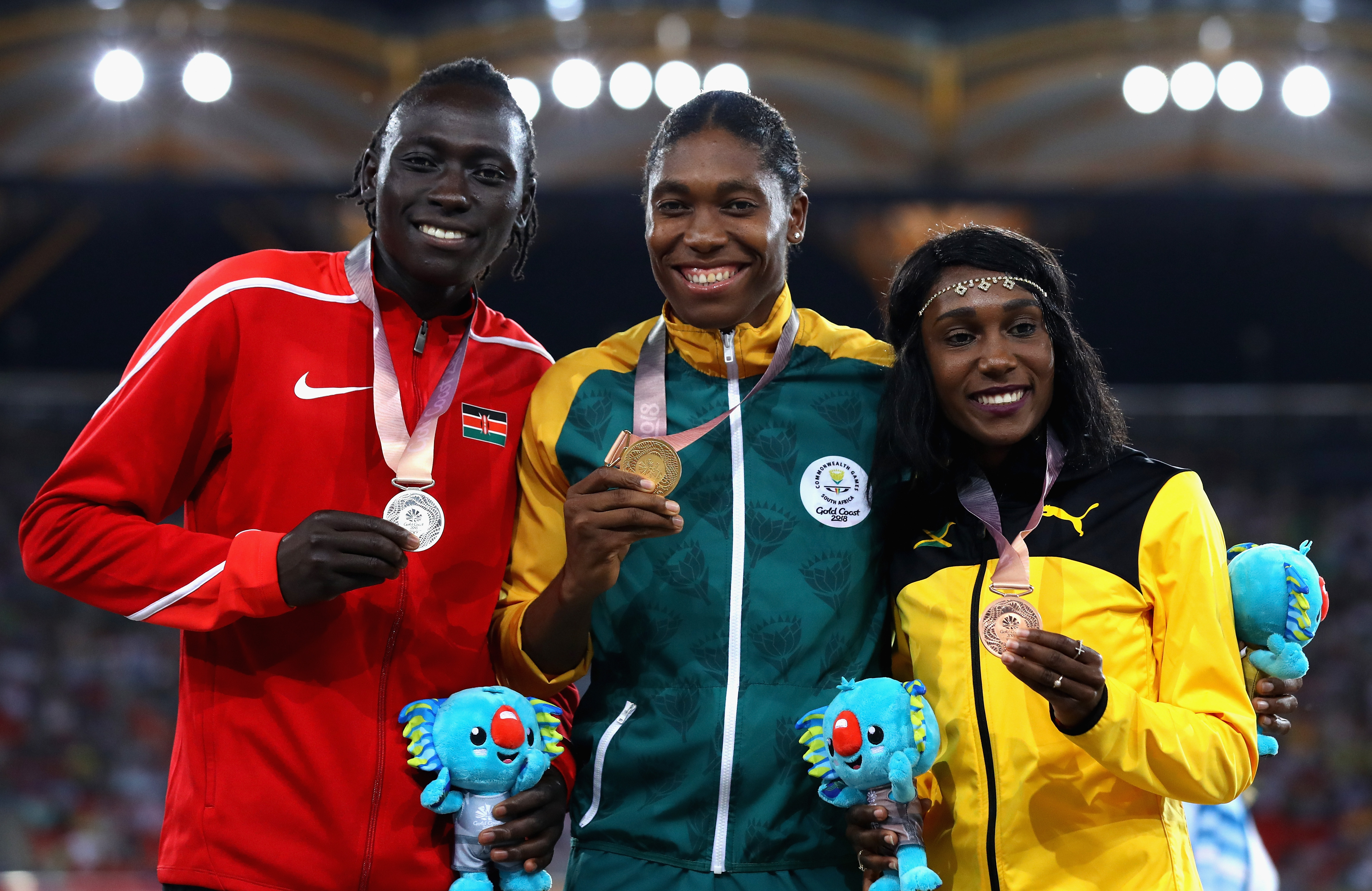 GOLD COAST, AUSTRALIA - APRIL 13: (L-R) Silver medalist Margaret Nyairera Wambui of Kenya, gold medalist Caster Semenya of South Africa and bronze medalist Natoya Goule of Jamaica pose during the medal ceremony for the Women?s 800 metres during athletics on day nine of the Gold Coast 2018 Commonwealth Games at Carrara Stadium on April 13, 2018 on the Gold Coast, Australia. (Photo by Mark Kolbe/Getty Images)