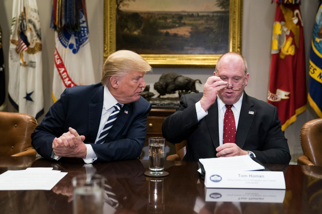 WASHINGTON, DC - MARCH 20: President Donald Trump and acting director of Immigration and Customs Enforcement Thomas Homan talk during a law enforcement roundtable on sanctuary cities in the Roosevelt Room at the White House on Tuesday, March 20, 2018 in Washington, DC. (Photo by Jabin Botsford/The Washington Post via Getty Images)