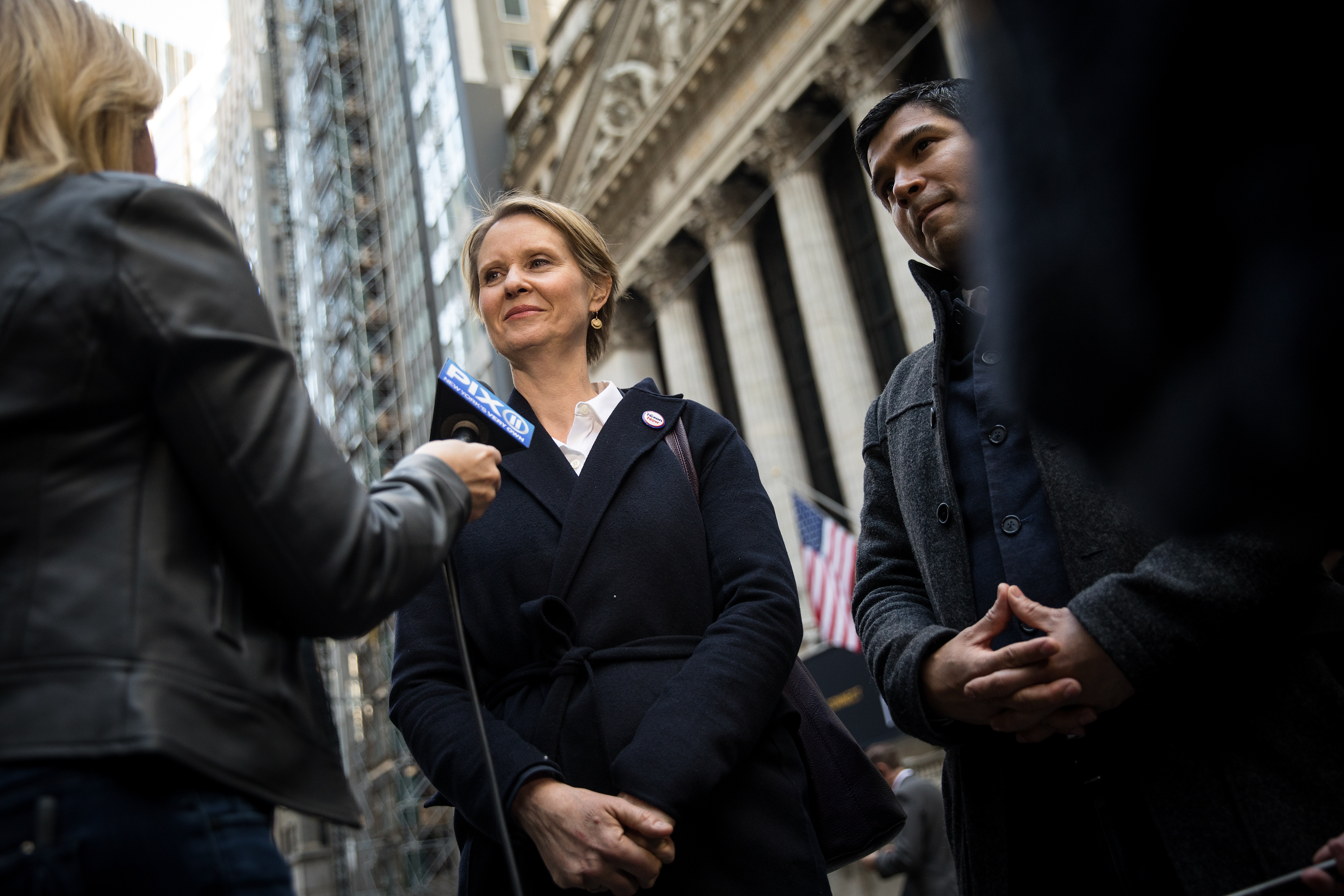 New York gubernatorial candidate Cynthia Nixon speaks with reporters following a rally against financial institutions' support of private prisons and immigrant detention centers, May 1, 2018 in New York City. (CREDIT: Drew Angerer/Getty Images)