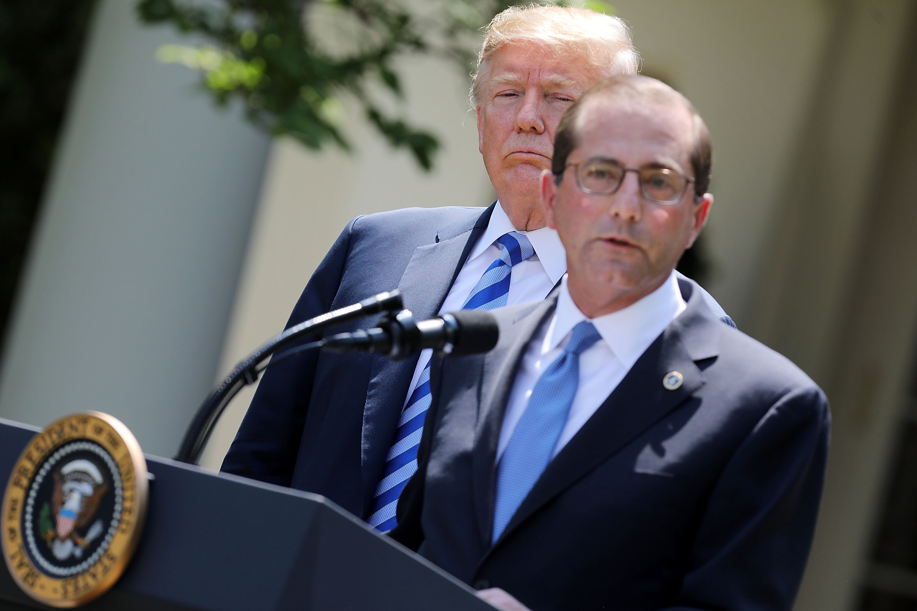 U.S. Health and Human Services Secretary Alex Azar (R) delivers remarks about drug prices with President Donald Trump in the Rose Garden at the White House May 11, 2018 in Washington, DC. (CREDIT: Chip Somodevilla/Getty Images)