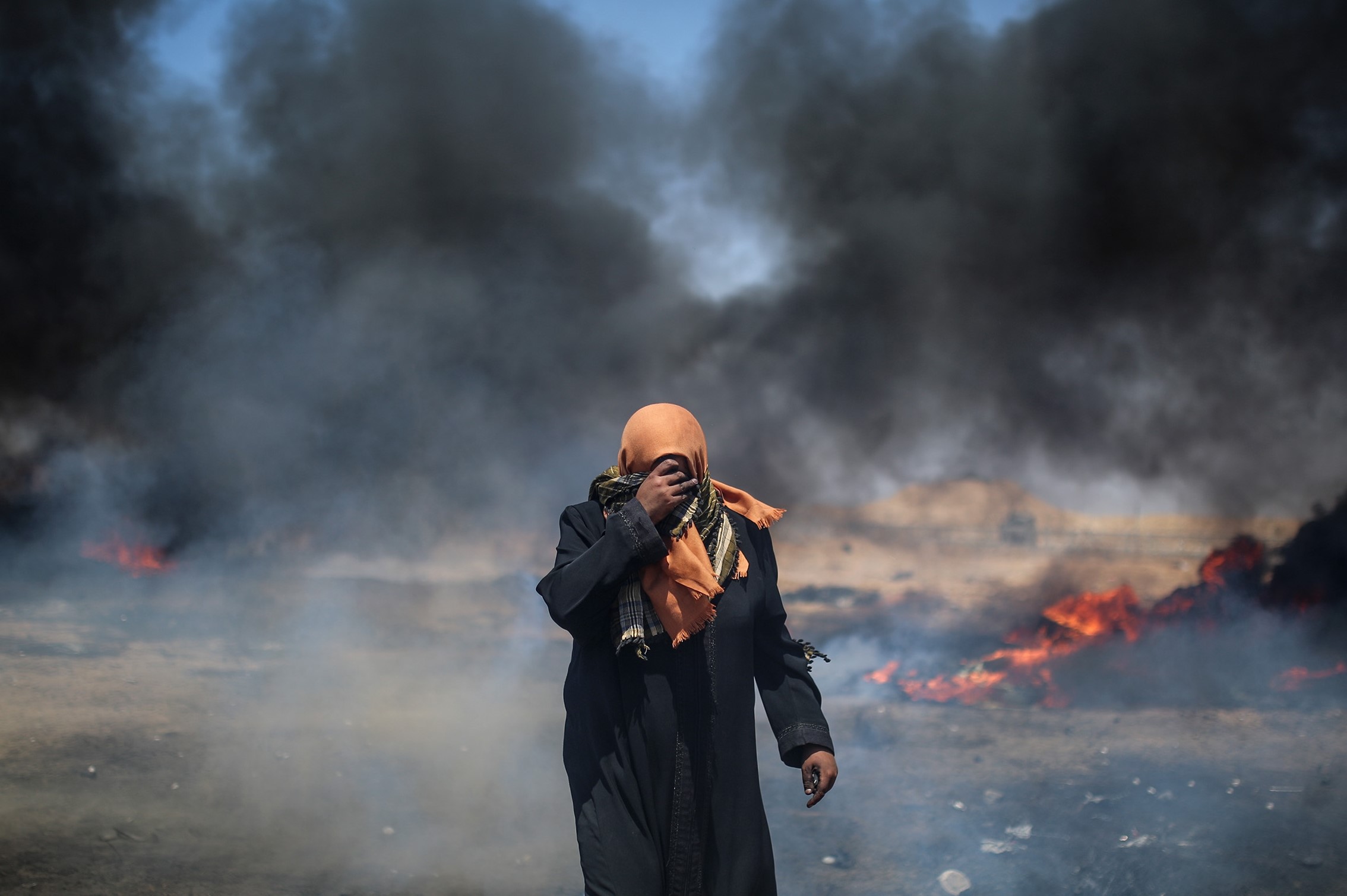 A Palestinian during a protest against United States' plans to relocate the U.S. Embassy from Tel Aviv to Jerusalem, at Gaza-Israel border in east Khan Yunis on May 14, 2018. CREDIT: Mustafa Hassona/Anadolu Agency/Getty Images.