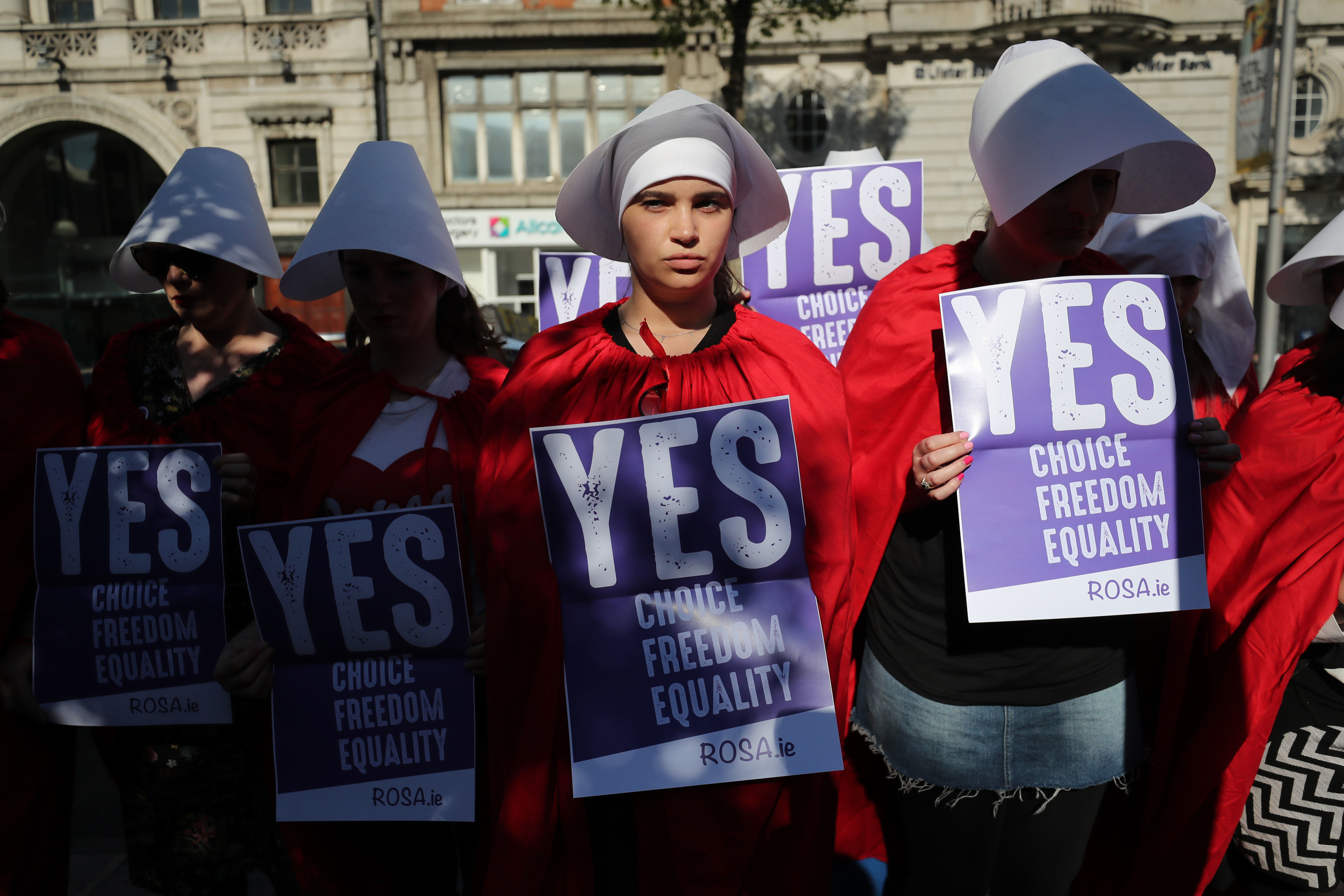Pro-choice activists call for repealing Ireland's abortion law while dressed as "Handmaidens." (CREDIT: Niall Carson/PA Images/Getty Images)