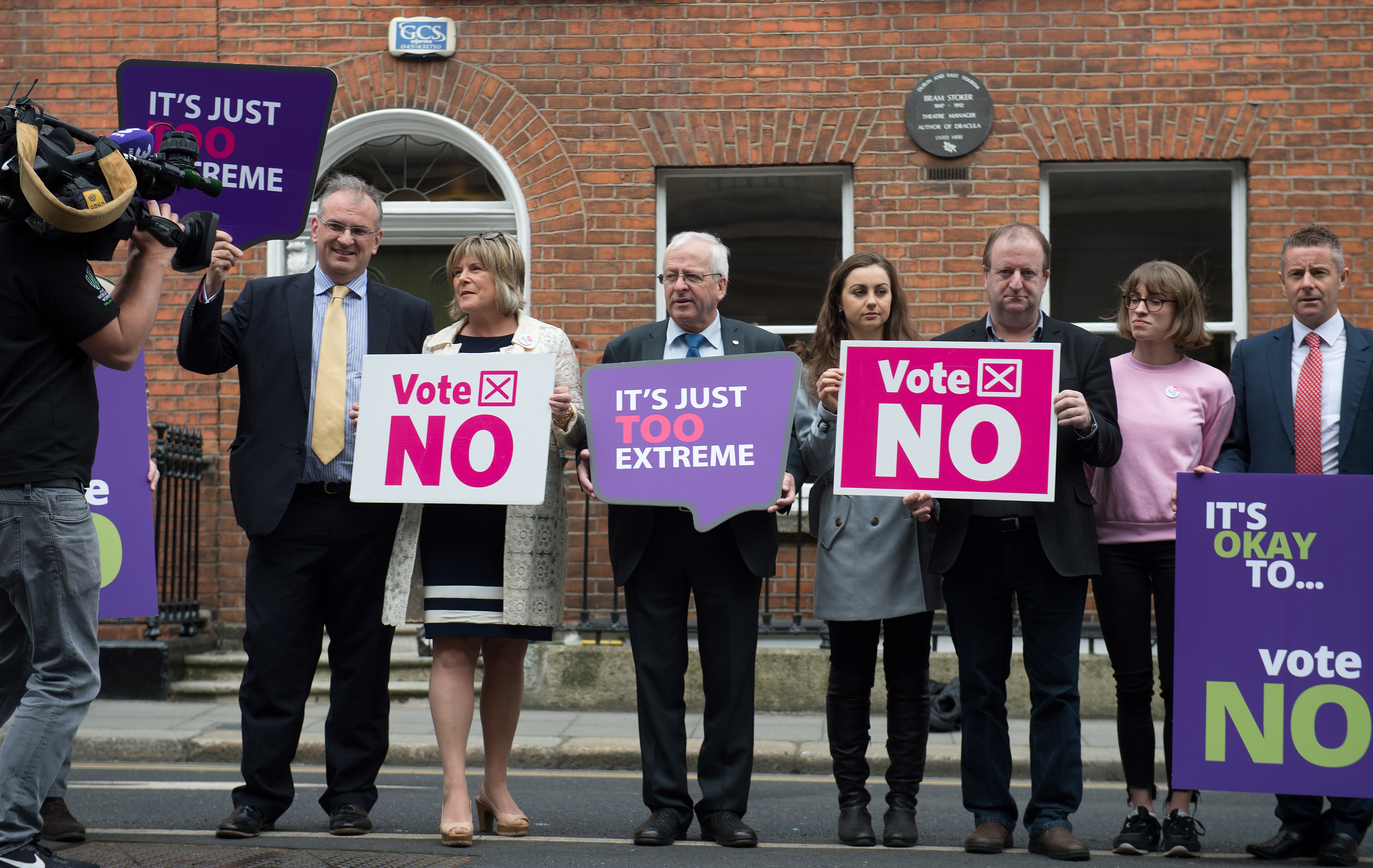 Activists from the "Love Both, Vote No" campaign, including politician Mattie McGrath (C), hold placards urging people to vote 'no' in the referendum to repeal the eighth amendment. (CREDIT: Barry Cronin/AFP/Getty Images)