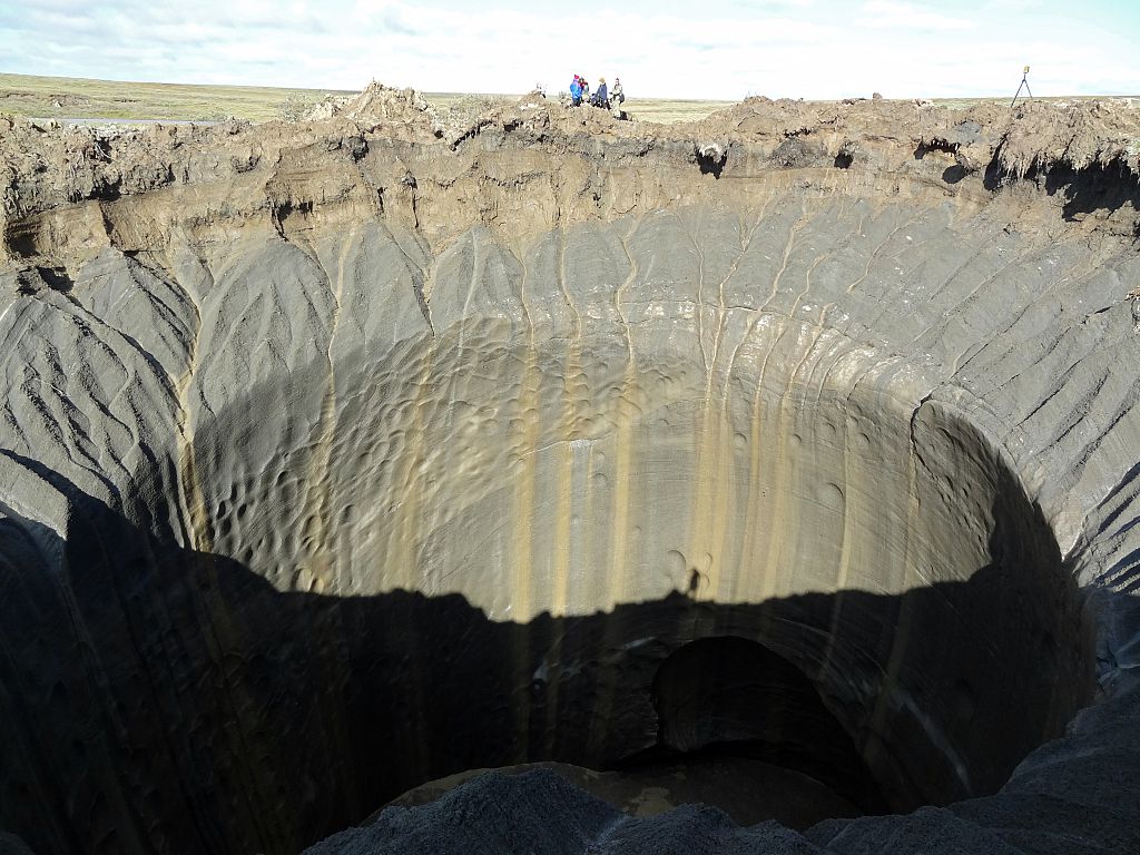 If President Trump had a summer White House in northern Siberia, it would be at risk from a warming-driven permafrost explosion, such as the one that created this 2014 crater. CREDIT: VASILY BOGOYAVLENSKY/AFP/Getty Images