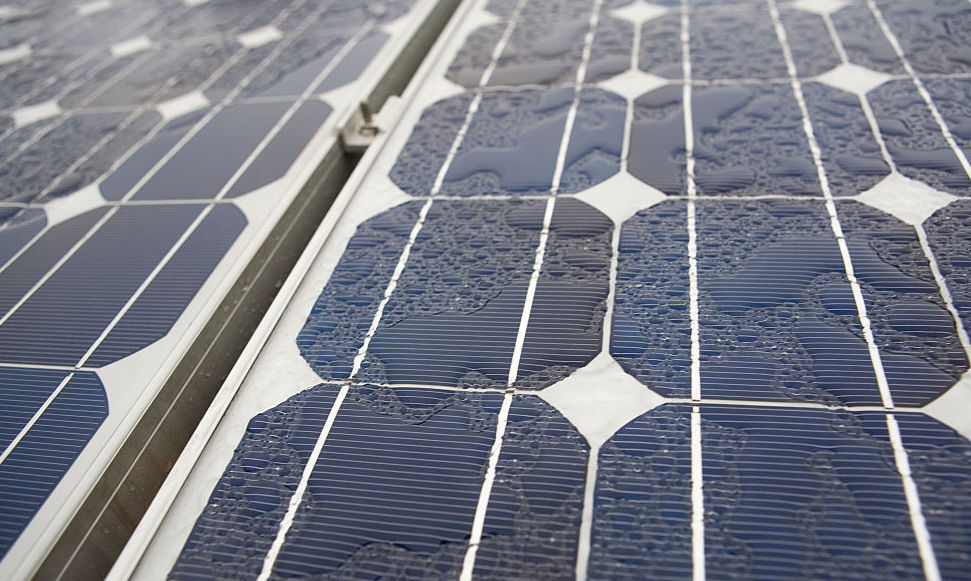 WET SOLAR PANELS ON A RAINY DAY. CREDIT: RAMIN TALAIE/CORBIS VIA GETTY IMAGES