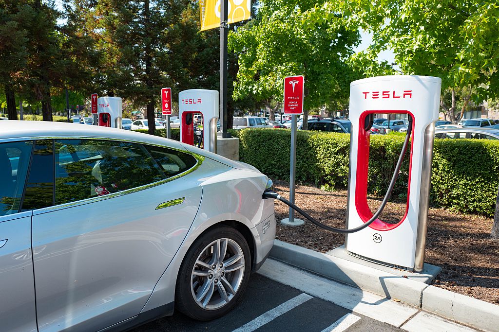 A Tesla charges at a rapid battery charging station in Mountain View, California, August 24, 2016. CREDIT: Smith Collection/Gado/Getty Images