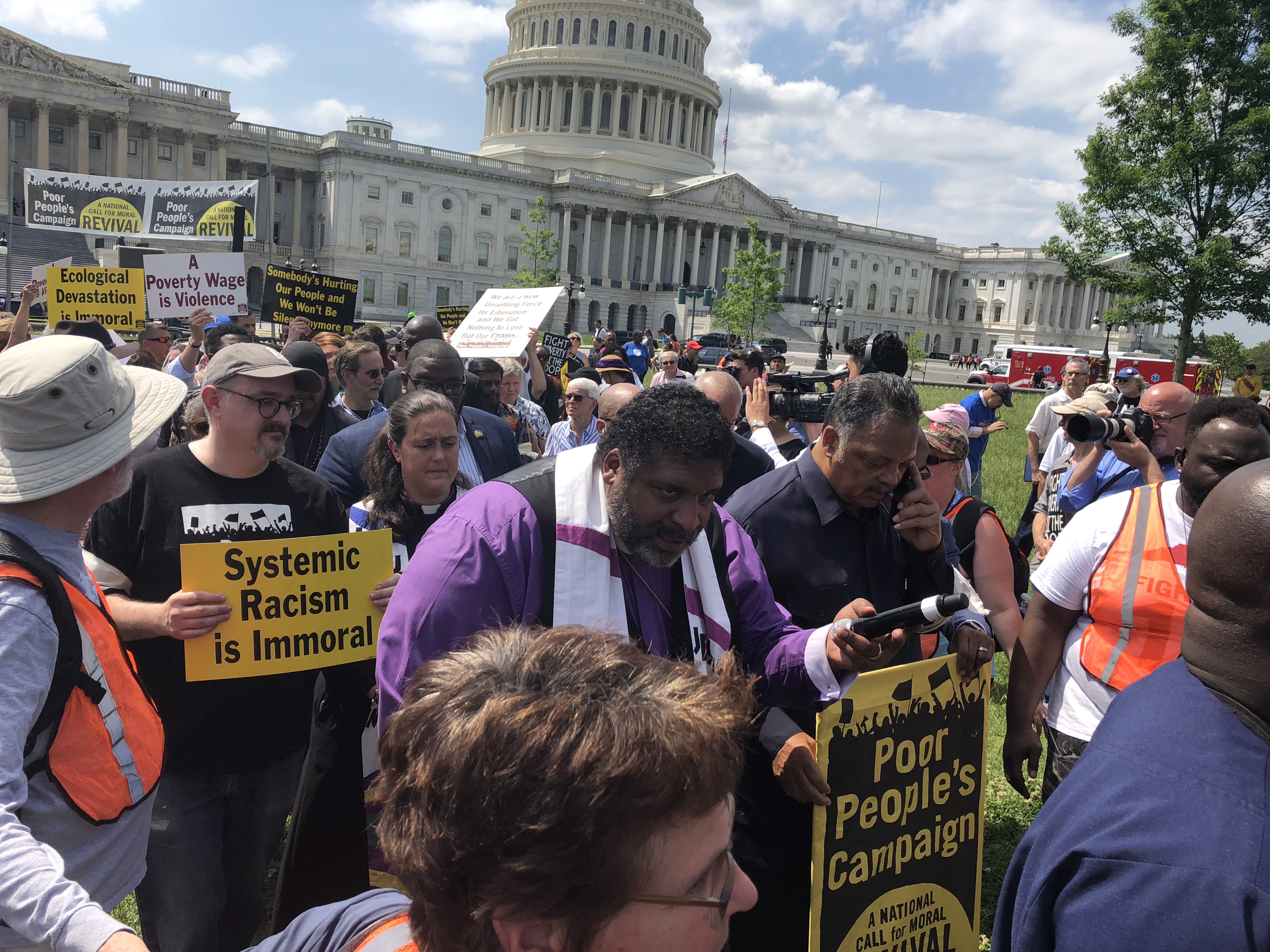 Rev. William Barber and Rev. Jesse Jackson begin their march into the U.S. Capitol, May 21, 2018. (CREDIT: Kira Lerner)