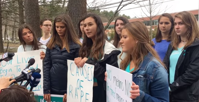 Students at Lincoln-Sudbury High School speak to reporters following their walkout on Monday. (Credit: Screenshot, MetroWest Daily News)