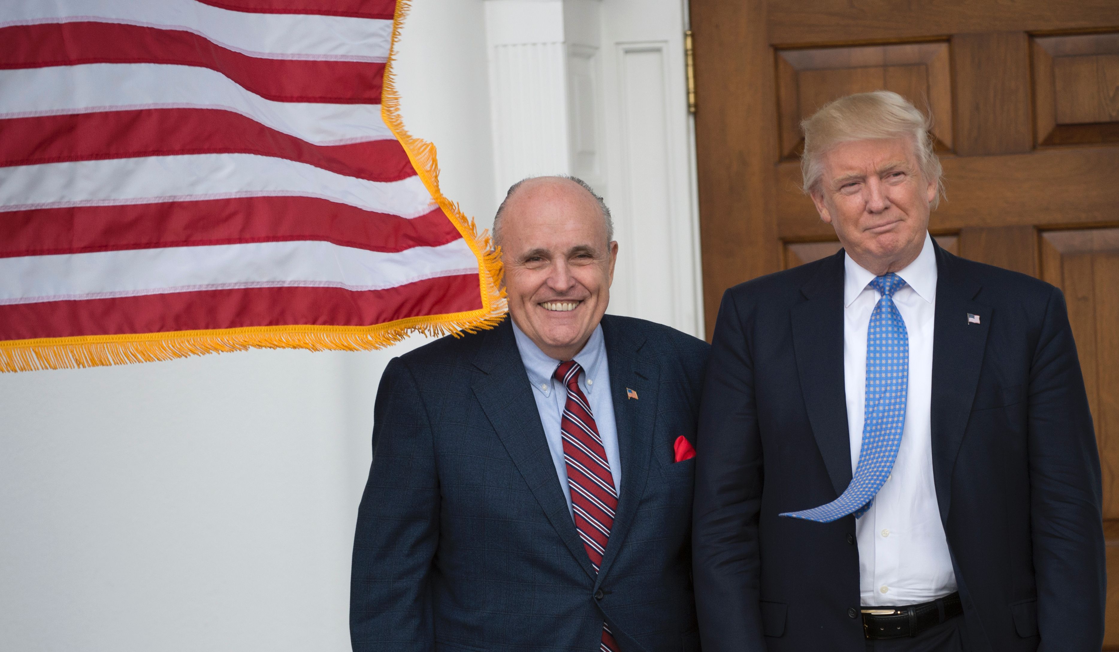 President Donald Trump and former New York City Mayor Rudy Giuliani. / DON EMMERT/AFP/Getty Images
