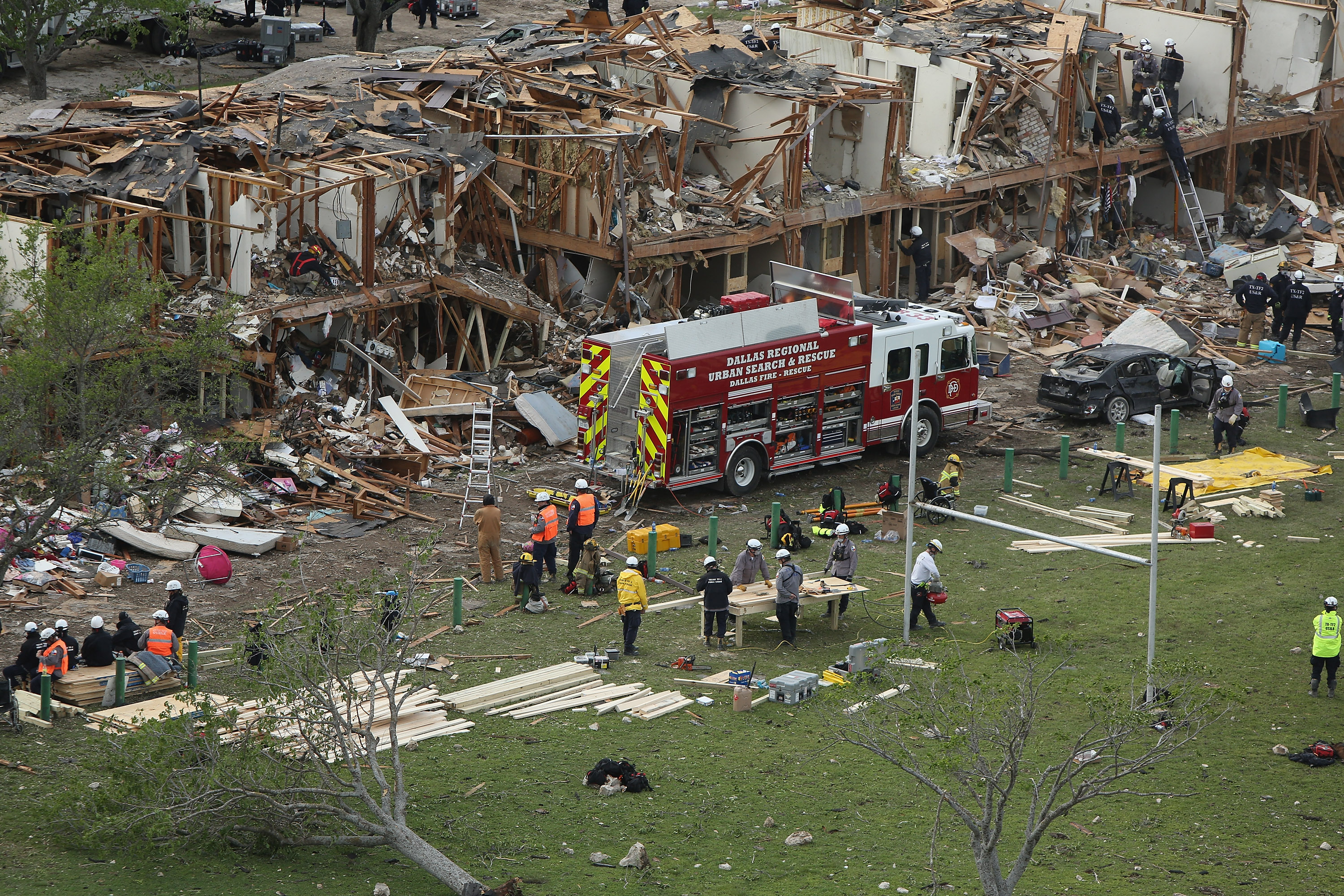 Search and rescue workers comb through what remains of a 50-unit apartment building the day after an explosion at the West Fertilizer Co. destroyed the building April 18, 2013 in West, Texas. CREDIT: Chip Somodevilla/Getty Images