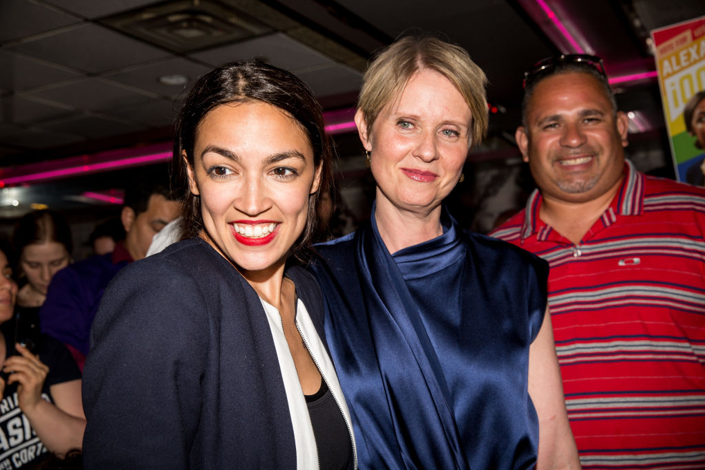 NEW YORK, NY - JUNE 26: Progressive challenger Alexandria Ocasio-Cortez is joined by New York gubenatorial candidate Cynthia Nixon at her victory party in the Bronx after upsetting incumbent Democratic Representative Joseph Crowly on June 26, 2018 in New York City. Ocasio-Cortez upset Rep. Joseph Crowley in New York’s 14th Congressional District, which includes parts of the Bronx and Queens. (Photo by Scott Heins/Getty Images)