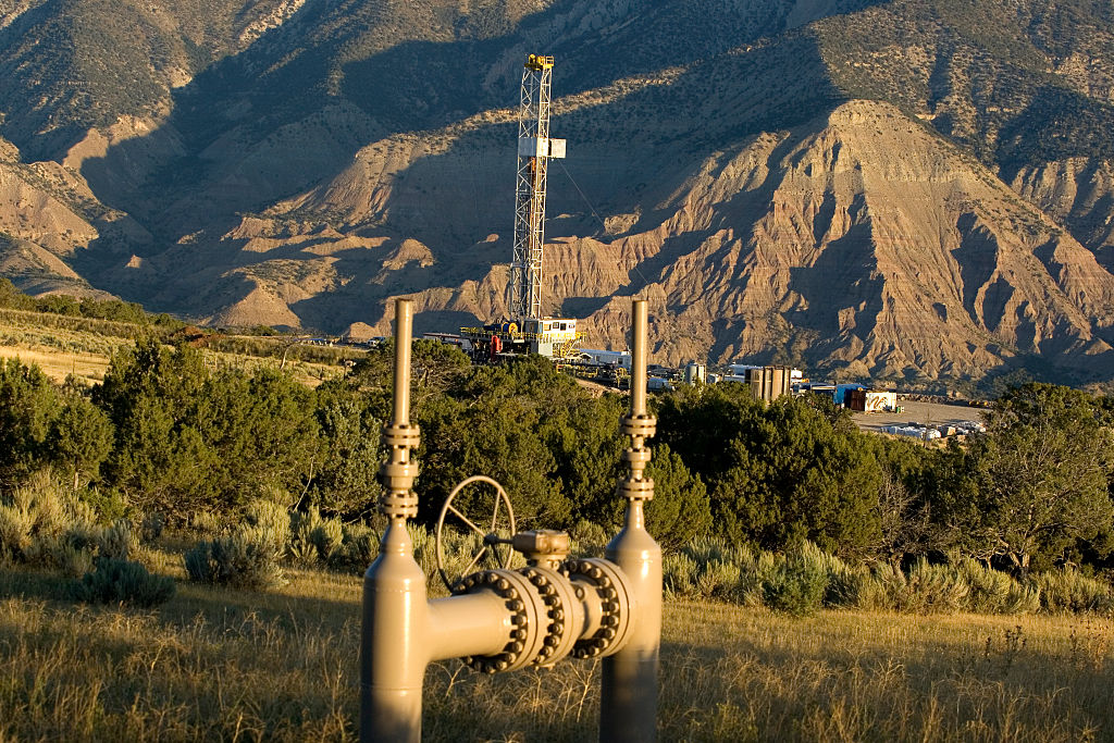 A rig drills for natural gas, near the cliffs of the Roan Plateau in Colorado. CREDIT: Steven D Starr/Corbis via Getty Images