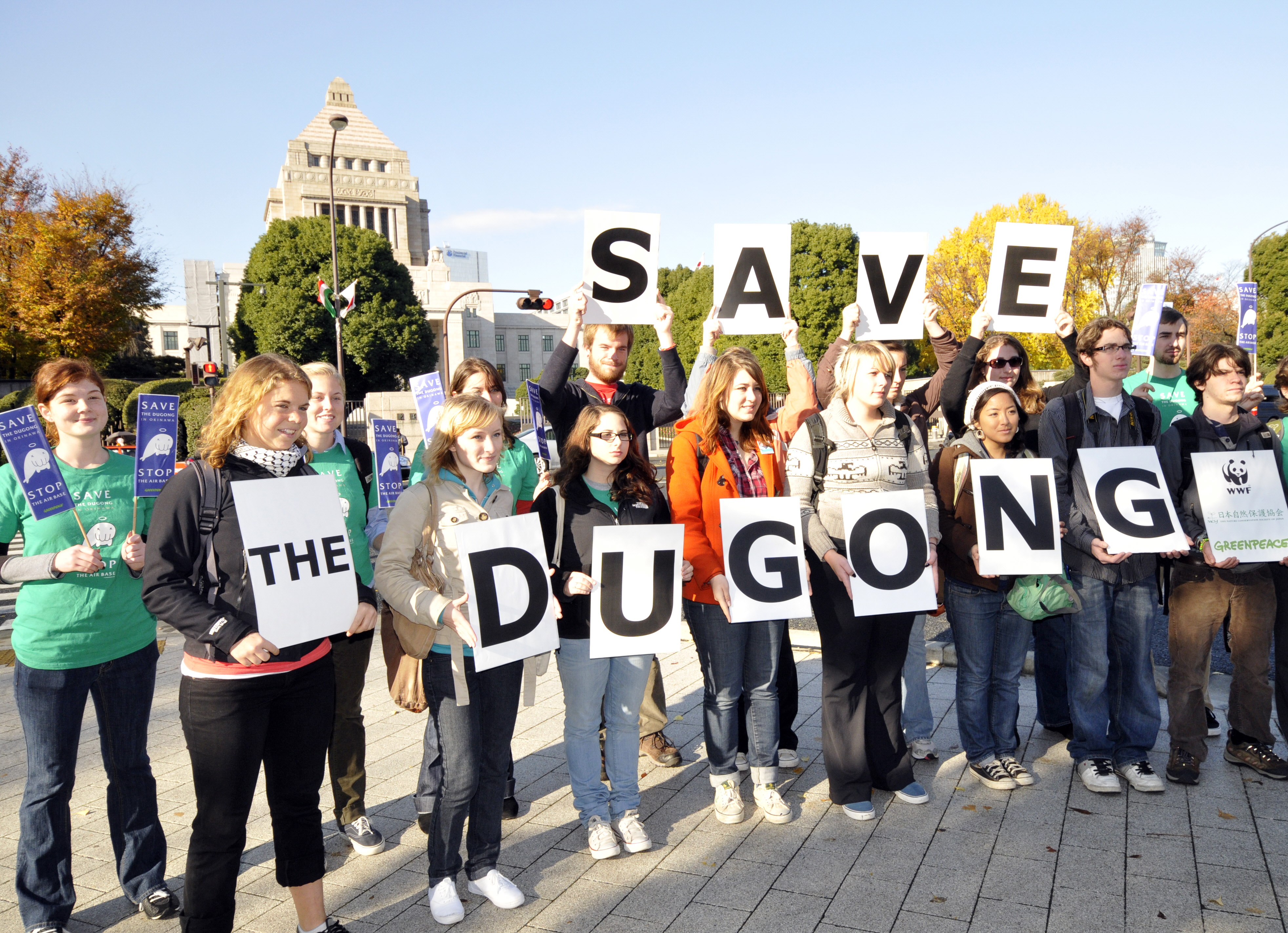 Americans traveled to Tokyo to express support for the endangered dugong in front of the Natonal Diet building. They were protesting relocation of a U.S. air base on the islands of Okinawa. CREDIT: YOSHIKAZU TSUNO/AFP/Getty Images