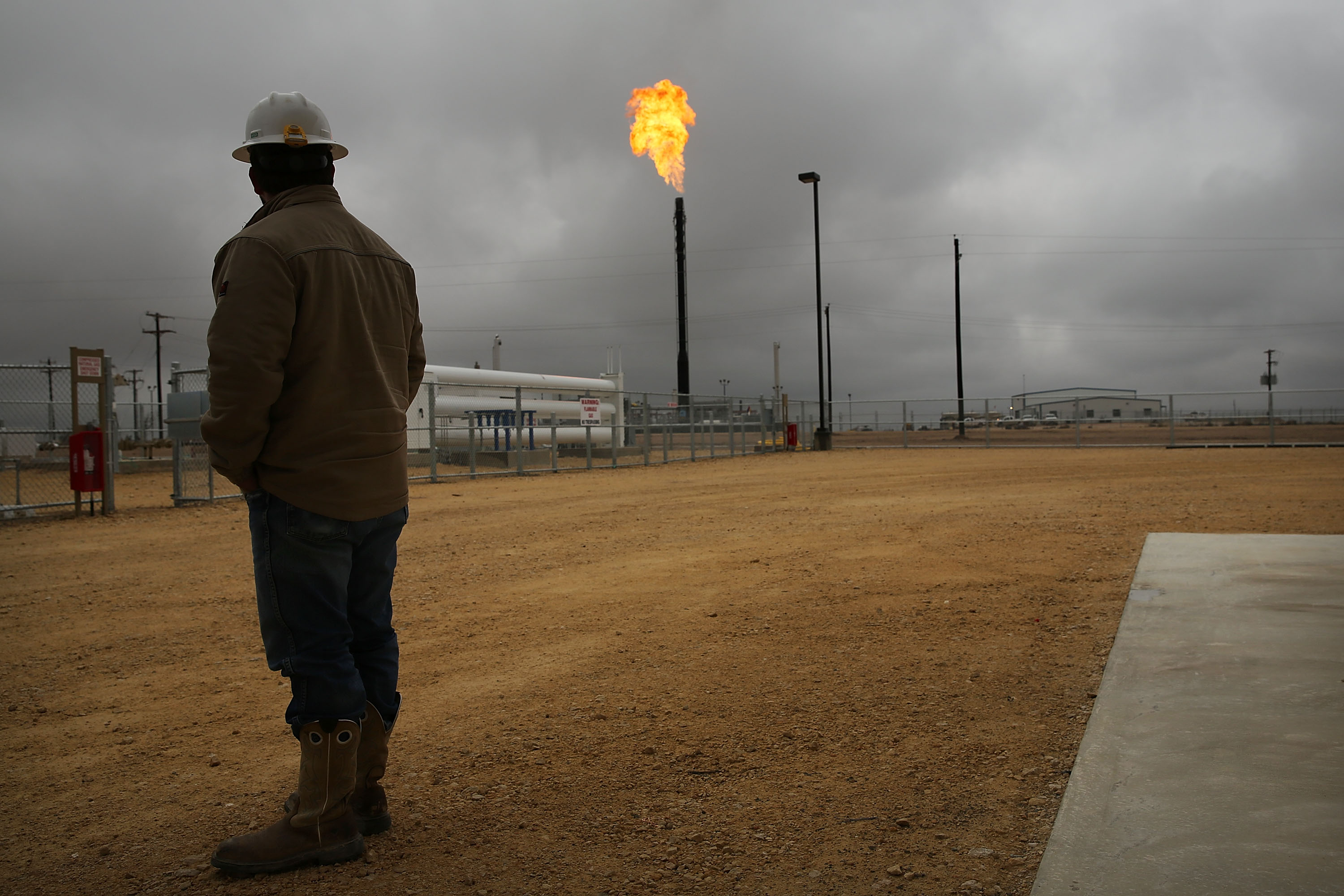 Flared natural gas is burned off at Apache Corp's operations at a natural gas operation in the Permian Basin of Texas. CREDIT: Spencer Platt/Getty Images