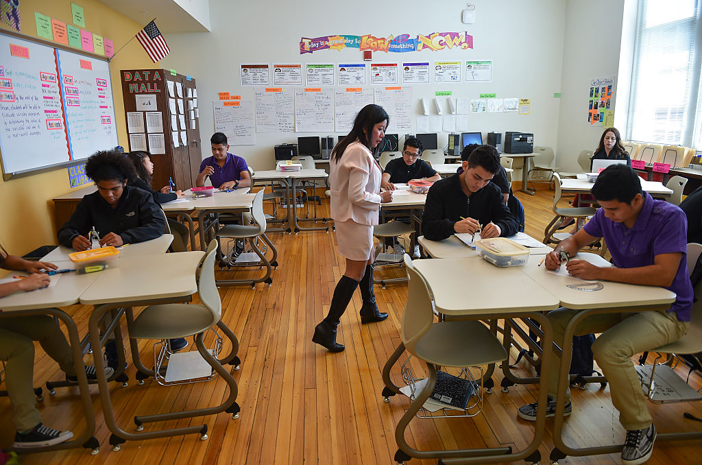 A teacher walks through her class while giving instructions during geometry in Washington, D.C. (Credit: Ricky Carioti/The Washington Post via Getty Images)