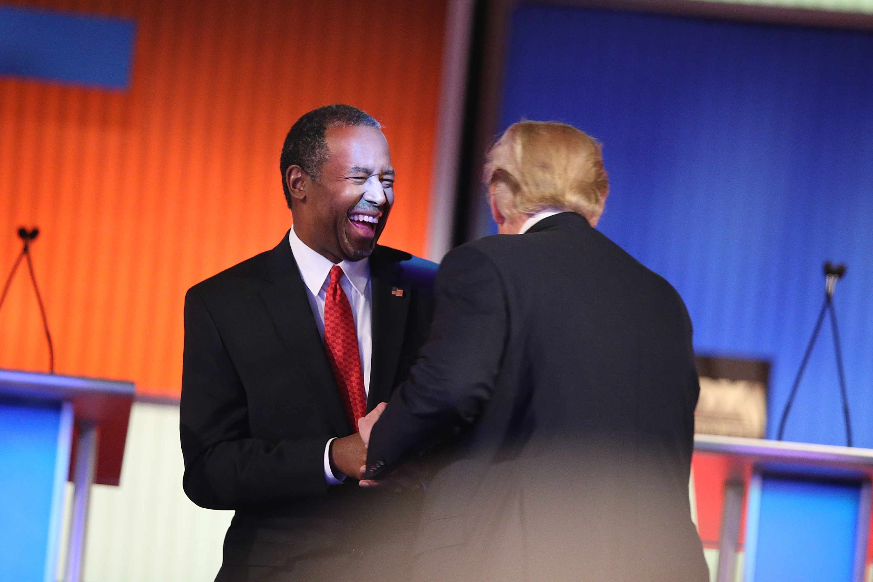 NORTH CHARLESTON, SC - JANUARY 14: Republican presidential candidates Ben Carson and Donald Trump laugh during a commercial break during the Fox Business Network Republican presidential debate at the North Charleston Coliseum and Performing Arts Center on January 14, 2016 in North Charleston, South Carolina. (Photo by Scott Olson/Getty Images)