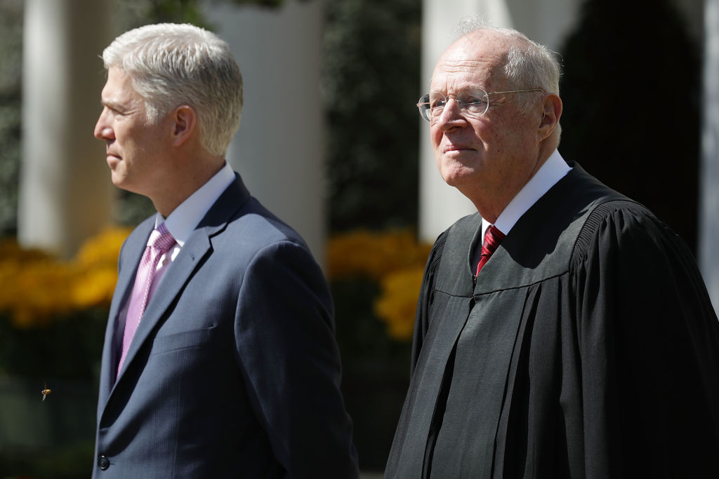 WASHINGTON, DC - U.S. Supreme Court Associate Justice Anthony Kennedy (R) prepares to administer the judicial oath to Judge Neil Gorsuch during a ceremony in the Rose Garden at the White House April 10, 2017 in Washington, DC. (Photo by Chip Somodevilla/Getty Images)