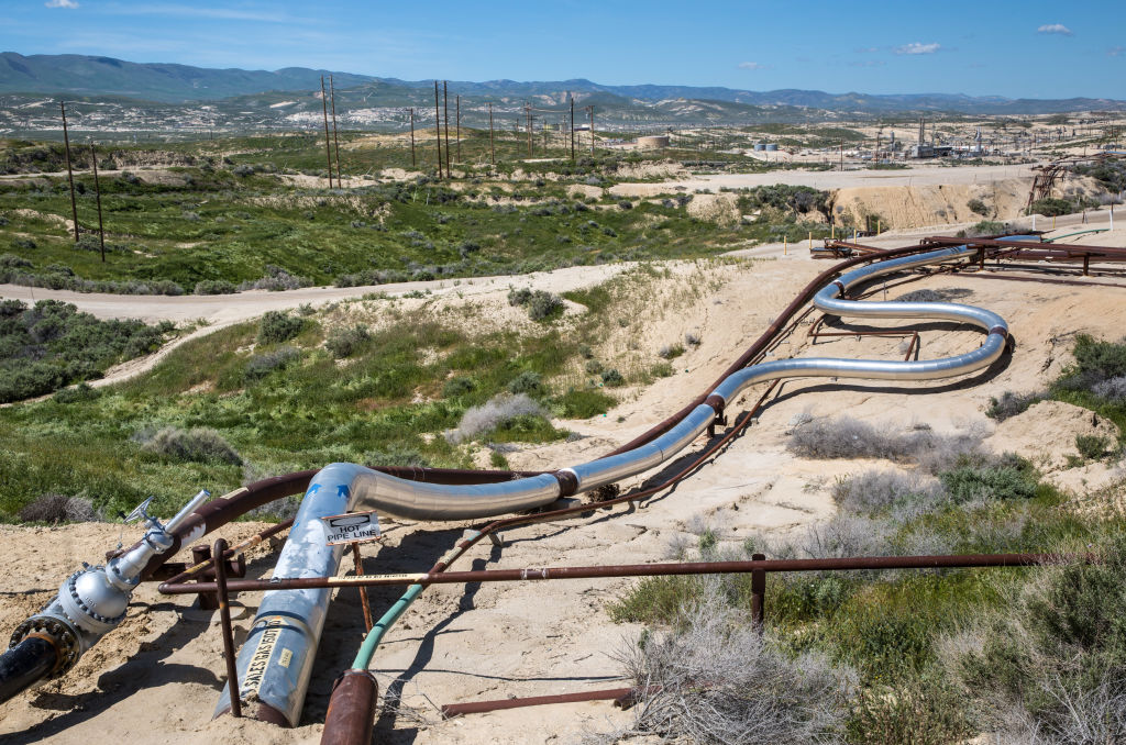 A Chevron oil field along Highway 58 is a hub of activity and appears to be pumping oil and natural gas at near full production on March 28, 2017, near McKittrick, California. CREDIT: George Rose/Getty Images