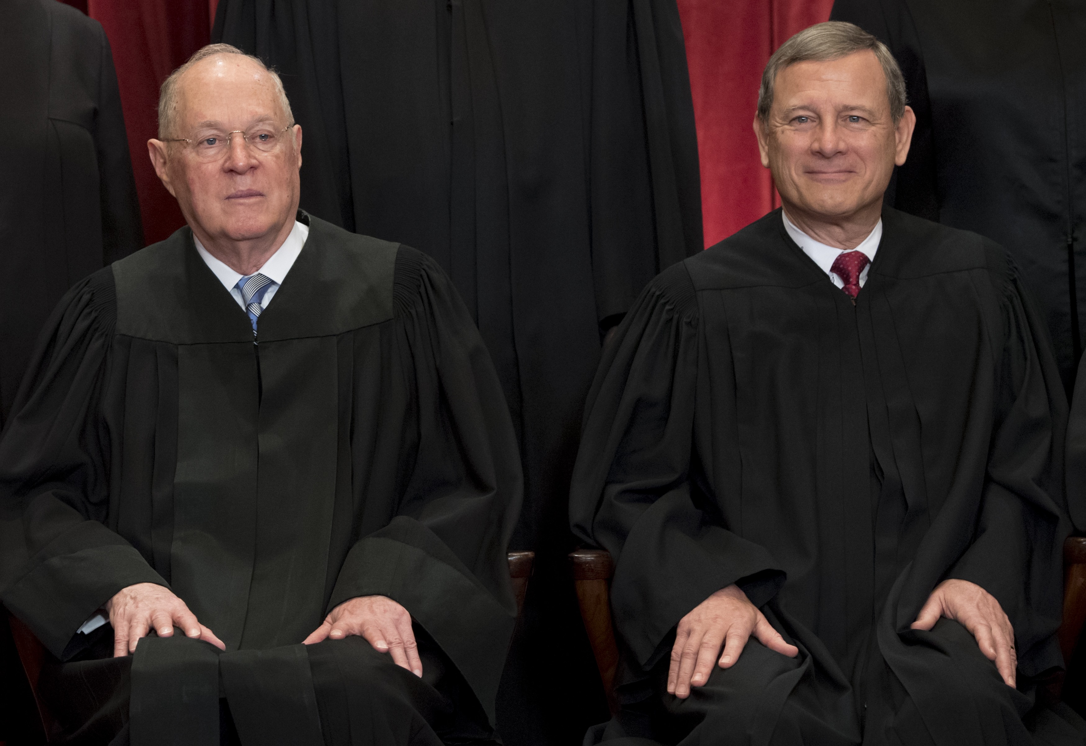 Chief Justice of the United States John G. Roberts (R) and US Supreme Court Associate Justice Anthony M. Kennedy (L) sit for an official photo with other members of the US Supreme Court in the Supreme Court in Washington, DC, June 1, 2017. / AFP PHOTO / SAUL LOEB (Photo credit should read SAUL LOEB/AFP/Getty Images)