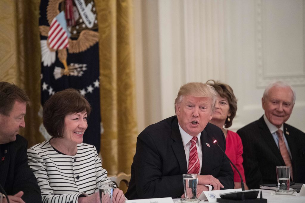 Sen. Susan Collins shares a laugh with President Donald Trump during a meeting of Republican Senators at the White House on June 27, 2017. (NICHOLAS KAMM/AFP/Getty Images)