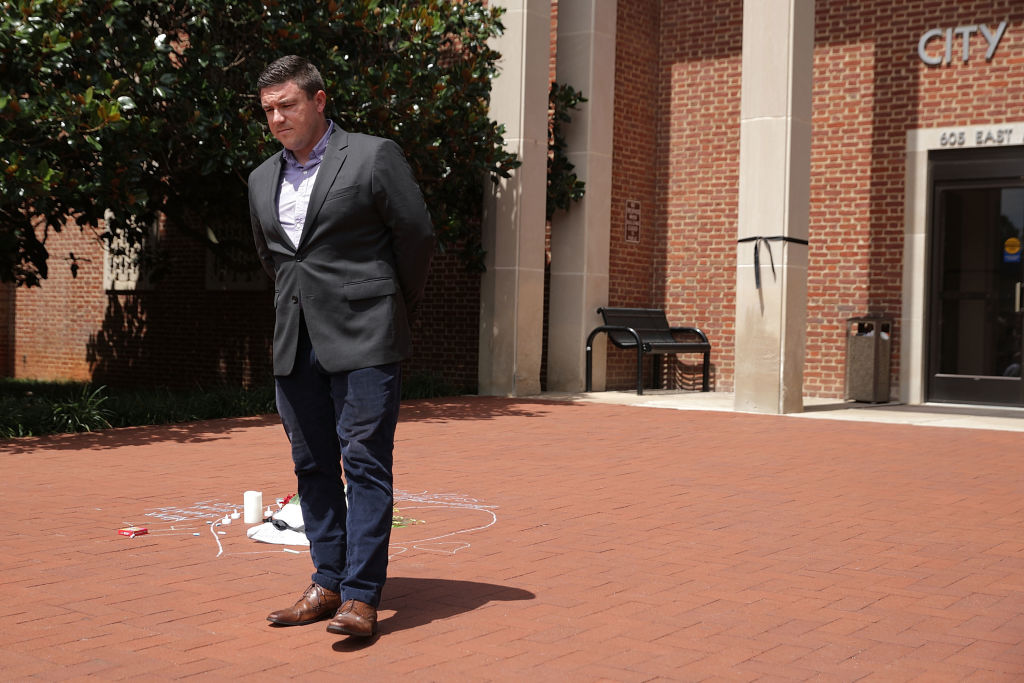 FILE PICTURE: Alt-right blogger Jason Kessler waits for protesters to quiet before begnning a news conference in front of City Hall August 13, 2017 in Charlottesville, Virginia. Kessler, who helped organize the Unite the Right rally one day earlier, blamed Charlottesville government officials and law enforcement for failing to protect the first amendment rights of the rally's participants, a collection of white supremacists, neo-Nazis, Ku Klux Klan members and alt-right supporters. (Photo by Chip Somodevilla/Getty Images)