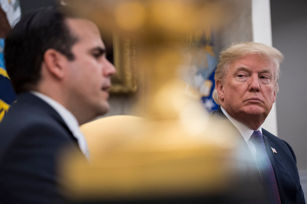 President Donald Trump and Governor Ricardo Rossello of Puerto Rico participate in a meeting in the Oval Office of the White House in Washington, DC on Thursday, Oct. 19, 2017. CREDIT: Photo by Jabin Botsford/The Washington Post via Getty Images