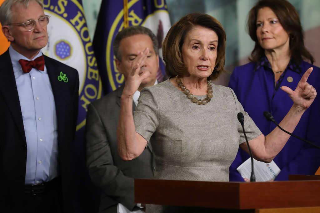 House Minority Leader Nancy Pelosi (D-CA) (3rd L). CREDIT: Chip Somodevilla/Getty Images