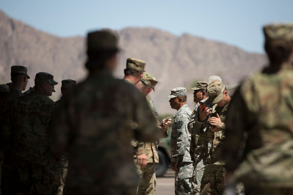 Members of the Arizona National Guard at the Papago Park Military Reservation in Phoenix. Arizona deployed its first 225 National Guard members to the Mexican border in April. CREDIT: CAITLIN O'HARA/AFP/Getty Images