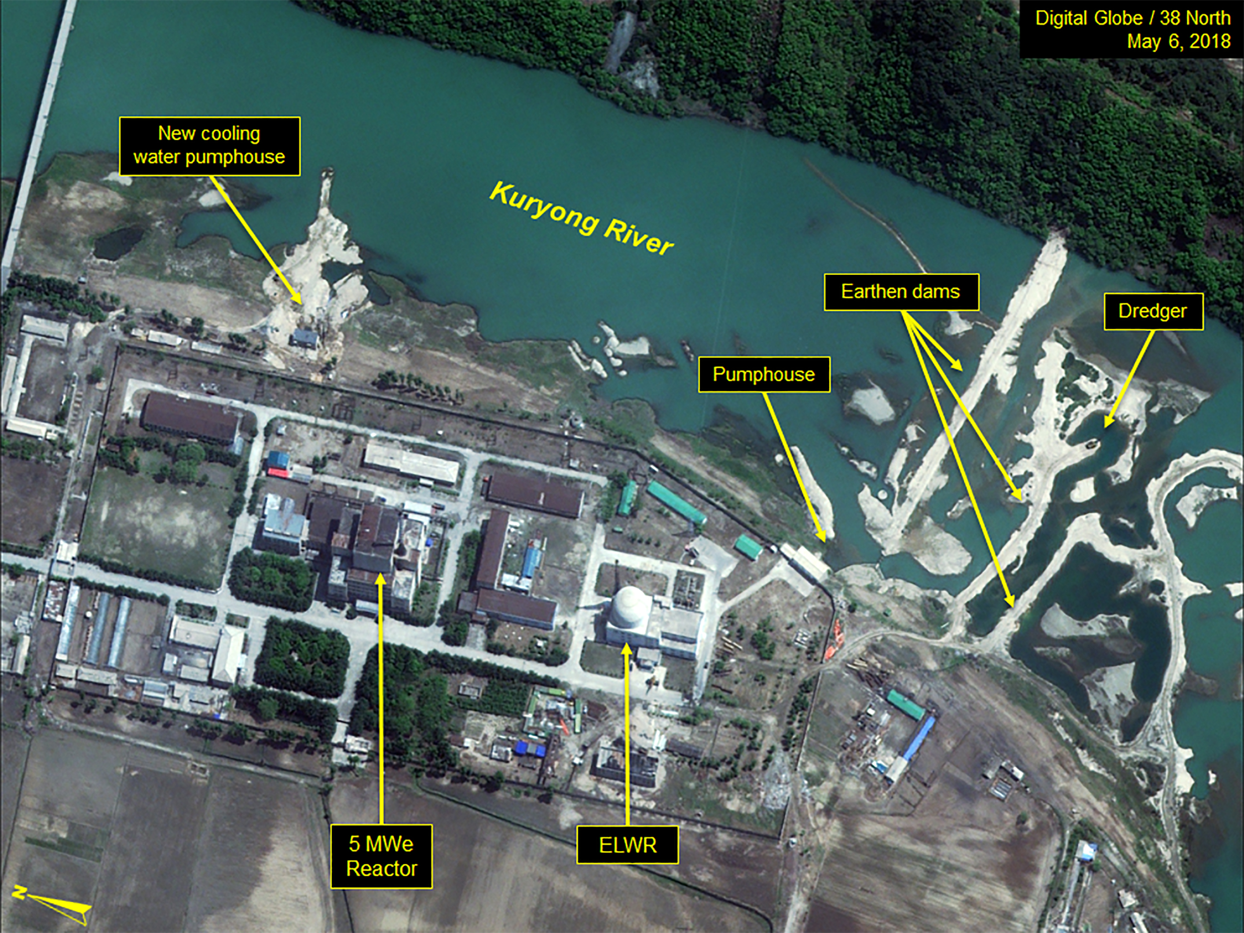 38 North has been tracking the developments at the Yongbyon facility, and this satellite image, from last month, shows a new cooling water pump house for the reactors' secondary cooling system as well as continued dredging of the river. CREDIT: DigitalGlobe/38 North via Getty Images