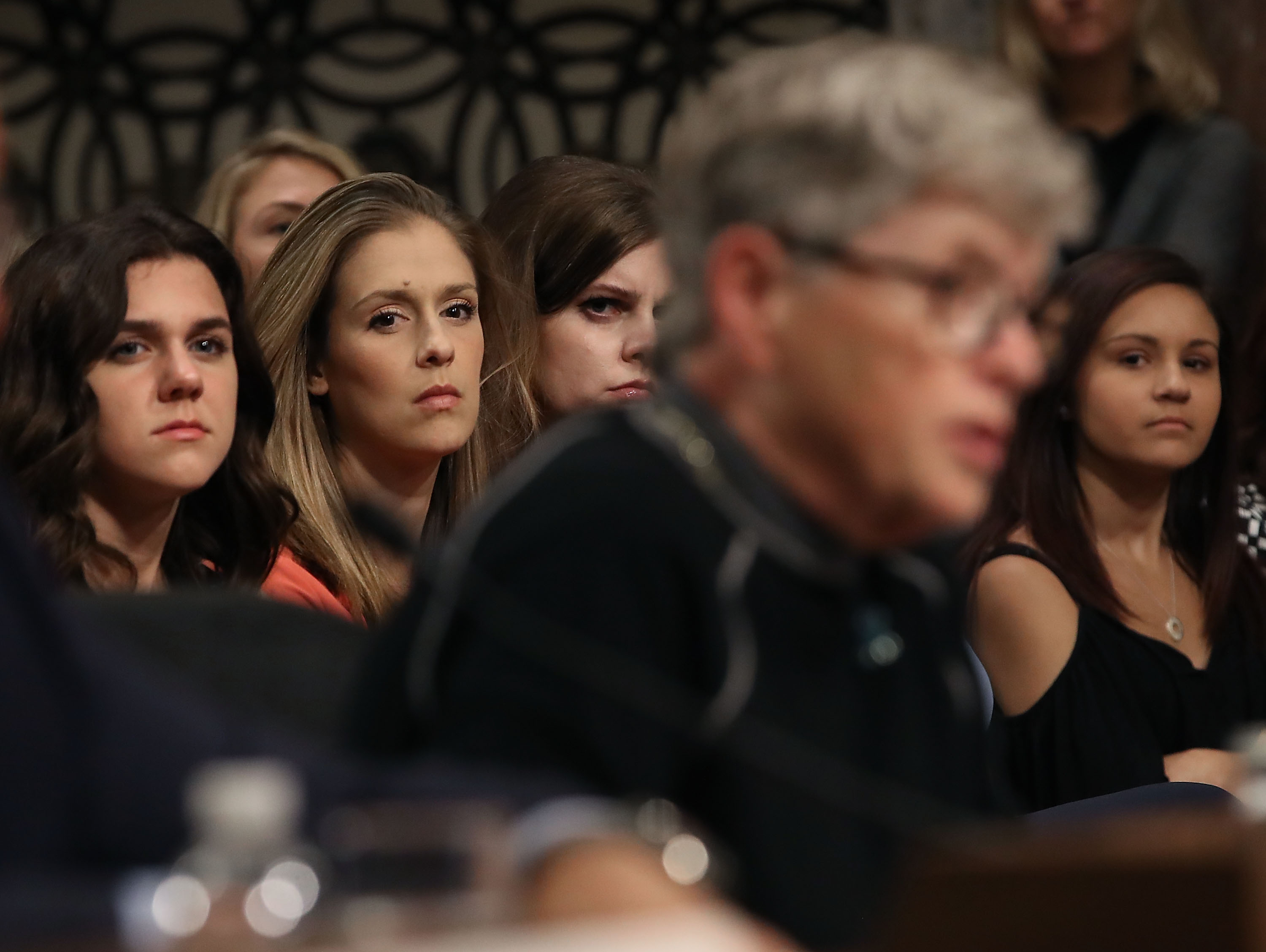 WASHINGTON, DC - JUNE 05: Young athletes watch as Lou Anna Simon, former president of Michigan State University, testifies during a Senate Commerce, Science and Transportation Committee hearing, on June 5, 2018 in Washington, DC. The hearing focused on preventing abuse in Olympic and amateur athletes and ensuring a safe and secure environment for athletes. (Photo by Mark Wilson/Getty Images)