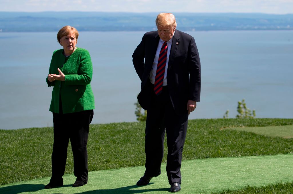 Trump and Merkel on June 8. (CREDIT: IAN LANGSDON/POOL/AFP/Getty Images)
