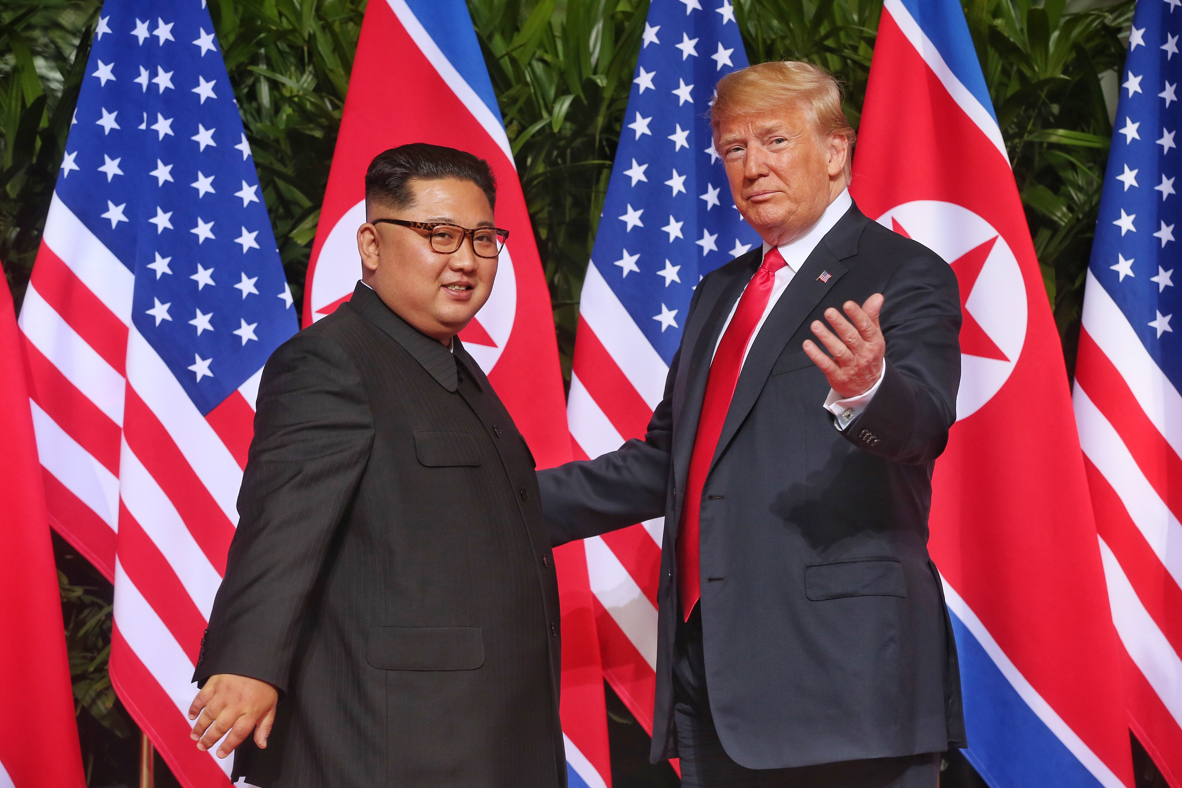North Korean leader Kim Jong Un meets U.S. President Donald Trump during the summit at the Capella Hotel on Sentosa island on June 12, 2018 in Singapore. (CREDIT: Kevin Lim/THE STRAITS TIMES/Handout/Getty Images)