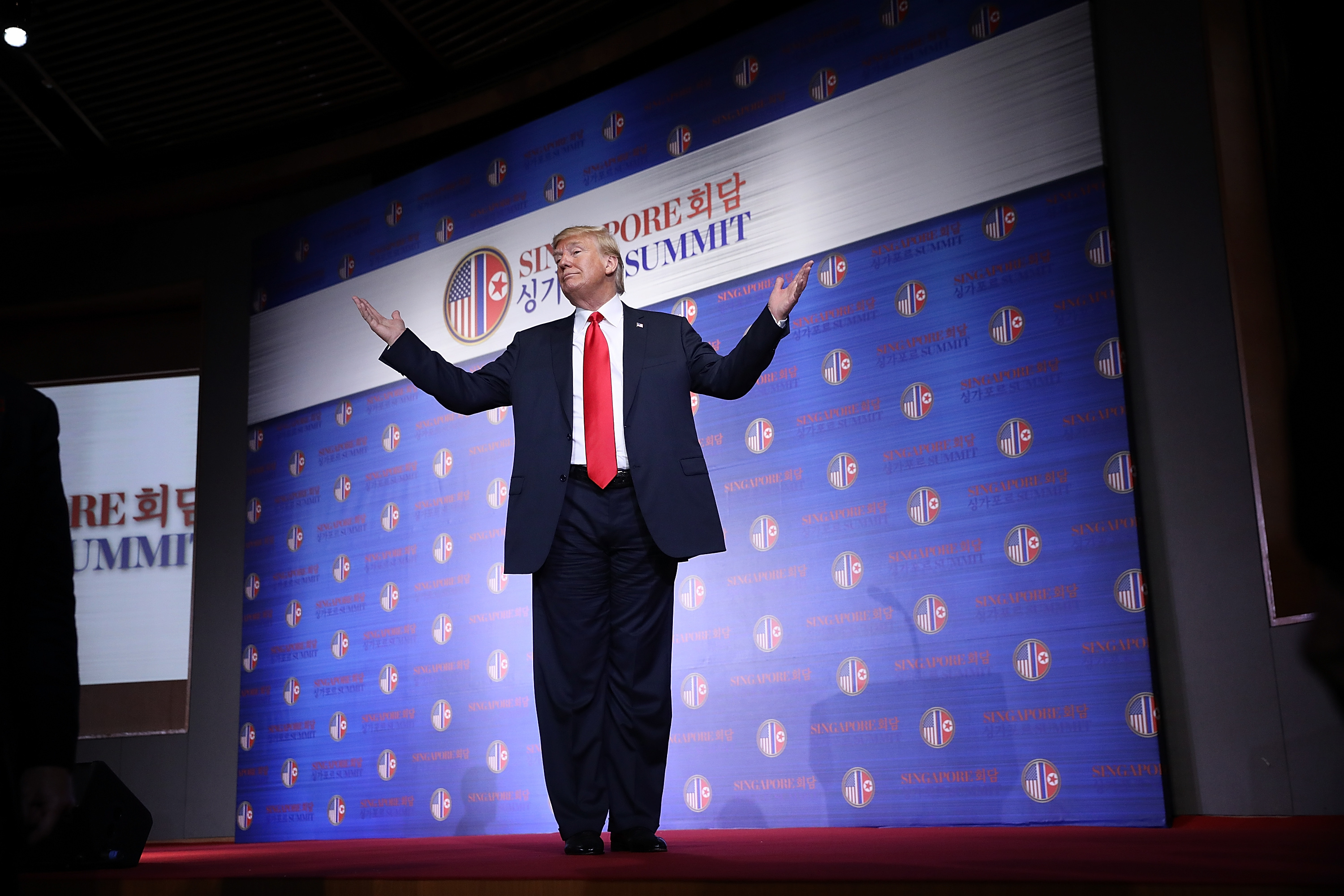 President Donald Trump answers a final question while departing a press conference following his meeting with North Korean leader Kim Jong-un June 12, 2018 in Singapore. CREDIT: Win McNamee/Getty Images.
