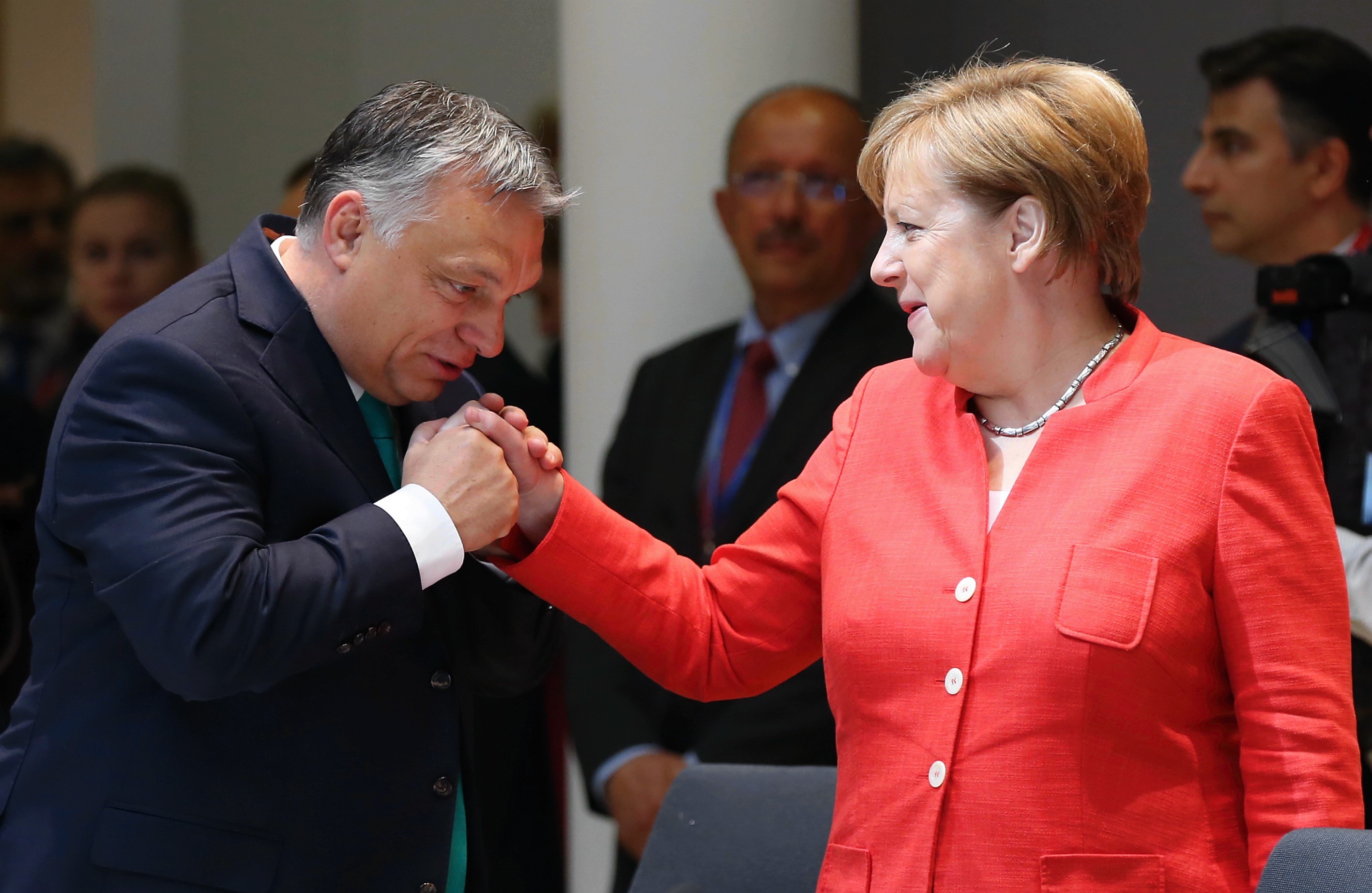 German Chancellor Angela Merkel chats with Prime Minister of Hungary Viktor Orban during the second day of the European Union Leaders' Summit in Brussels, Belgium on June 29, 2018. CREDIT: Dursun Aydemir/Anadolu Agency/Getty Images.