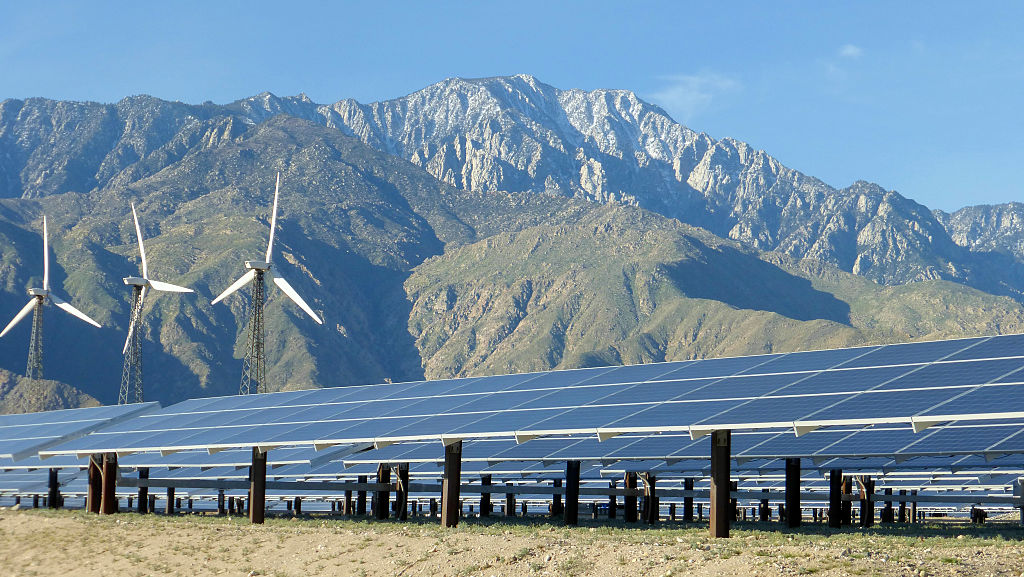 Solar Panels and wind turbines in Palm Springs, California. CREDIT: Connie J. Spinardi/Getty Images