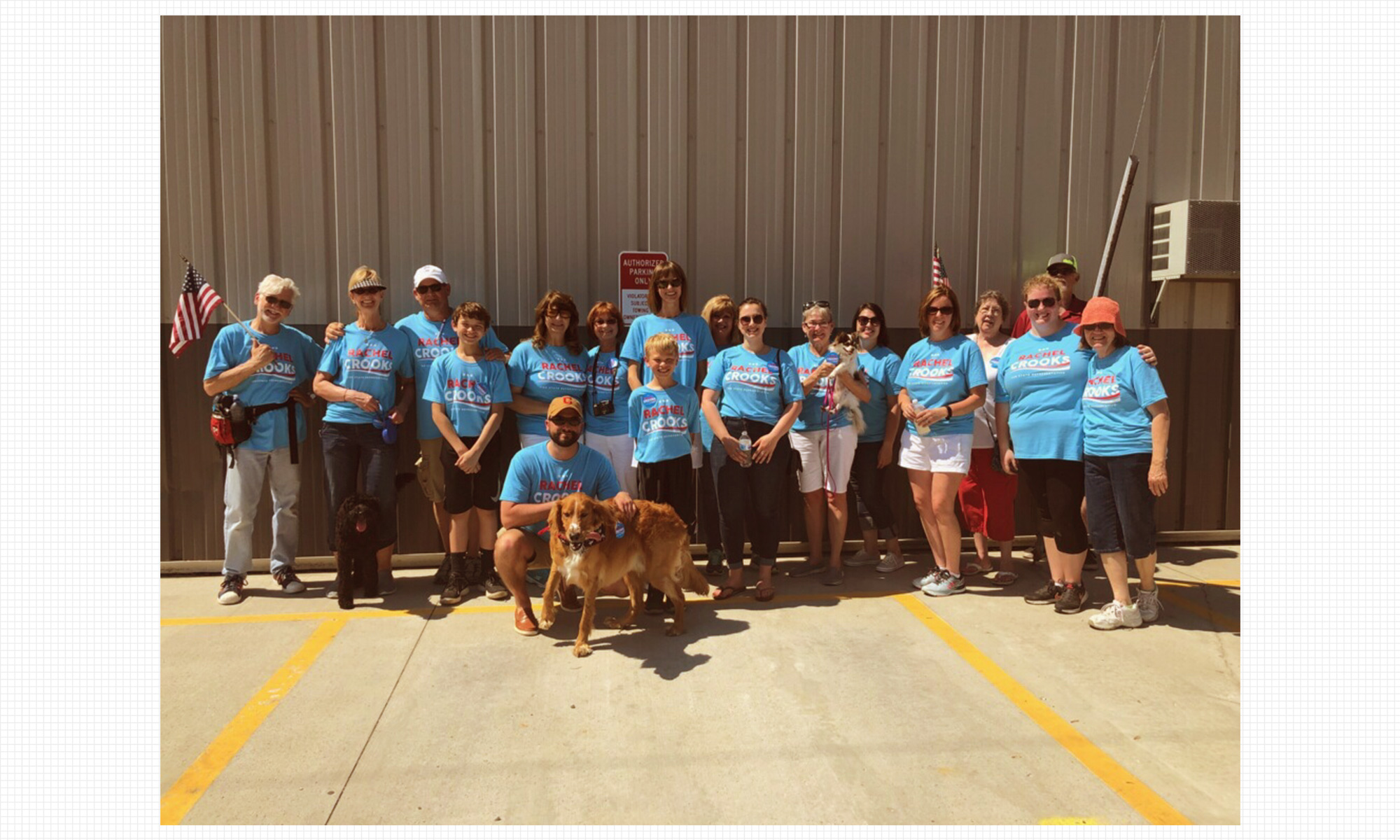 Crooks (center) with a group of supporters at a recent local parade. CREDIT: Crystal Henson/EDIT by Diana Ofosu