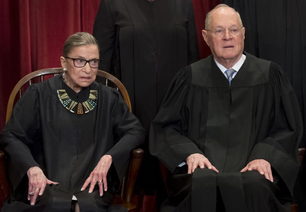 US Supreme Court Associate Justice Anthony M. Kennedy (R) and Associate Justice Ruth Bader Ginsburg (L) sit for an official photo with other members of the US Supreme Court in the Supreme Court in Washington, DC, June 1, 2017. (Credit: SAUL LOEB/AFP/Getty Images)